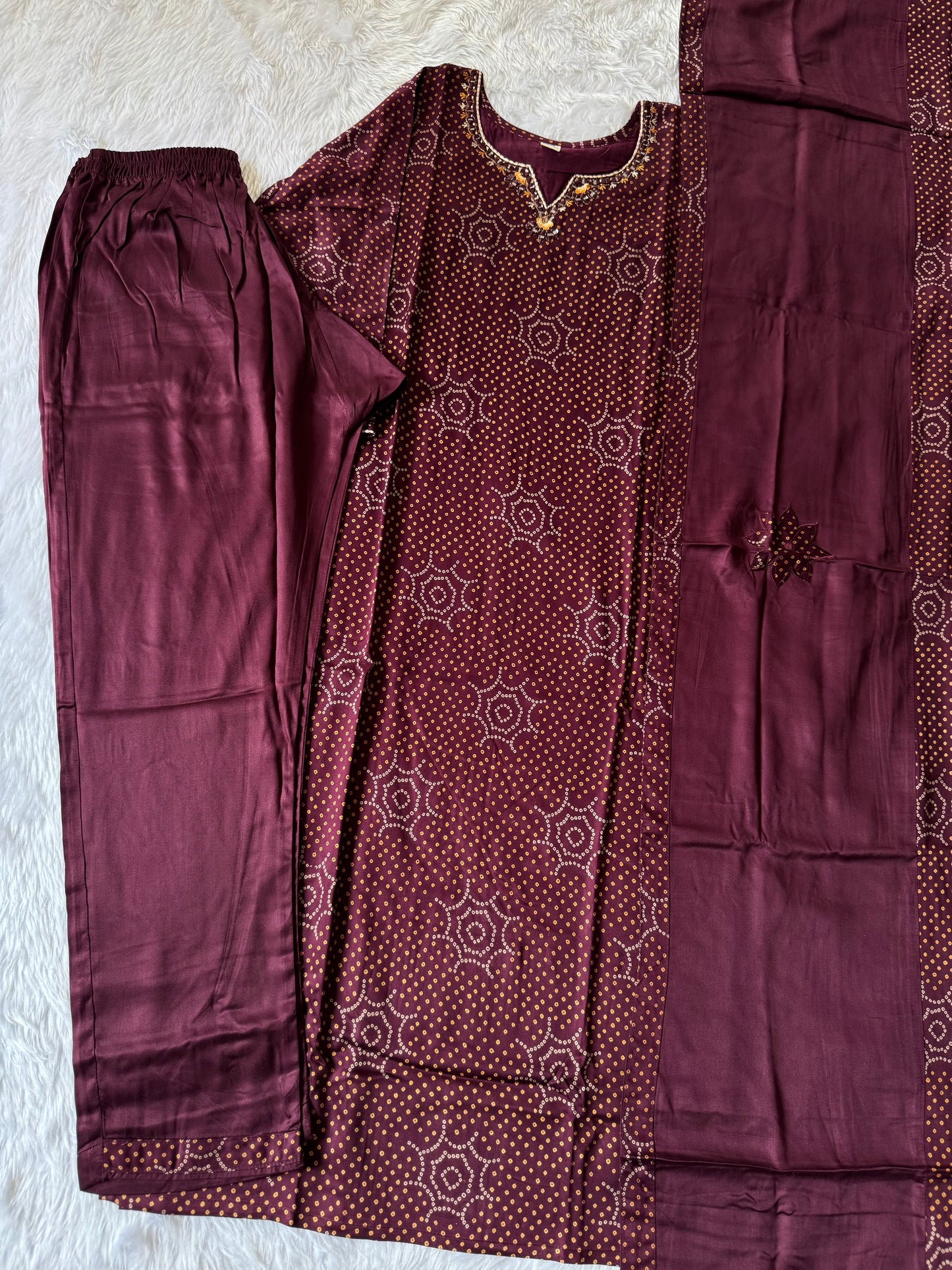 MD-179 This deep Wine Bandhani suit set blends traditional patterns with subtle embellishments, perfect for a timeless ethnic charm."