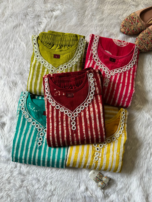 MD-174 This vibrant red Bandhani suit set, adorned with mirror work and traditional patterns, brings elegance and heritage together in perfect harmony."