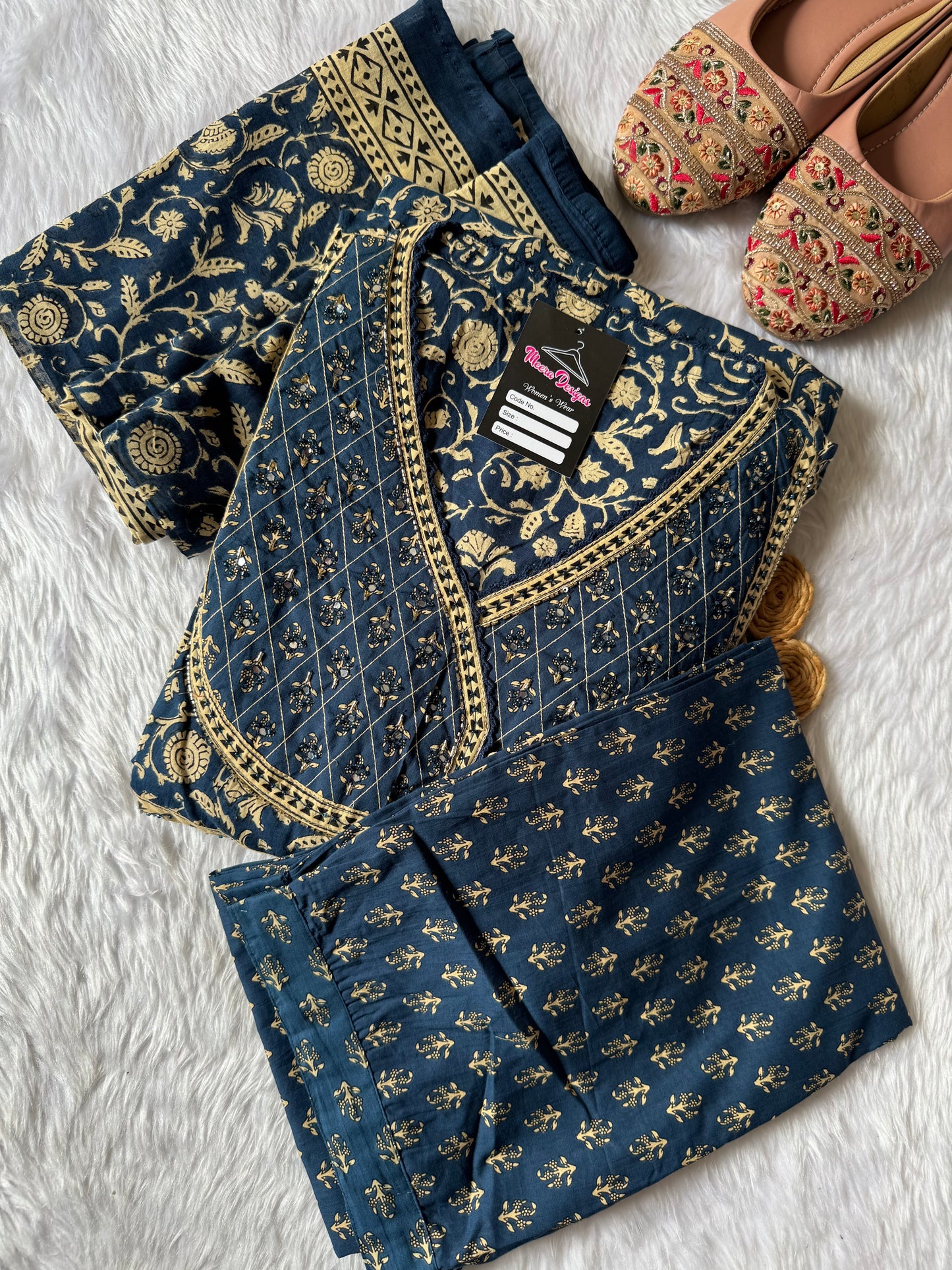 MD-183 elegance meets timeless tradition 🌺✨
This beautifully printed suit set features intricate floral and paisley motifs with delicate gota-inspired borders — perfect for festive gatherings or a graceful day look.