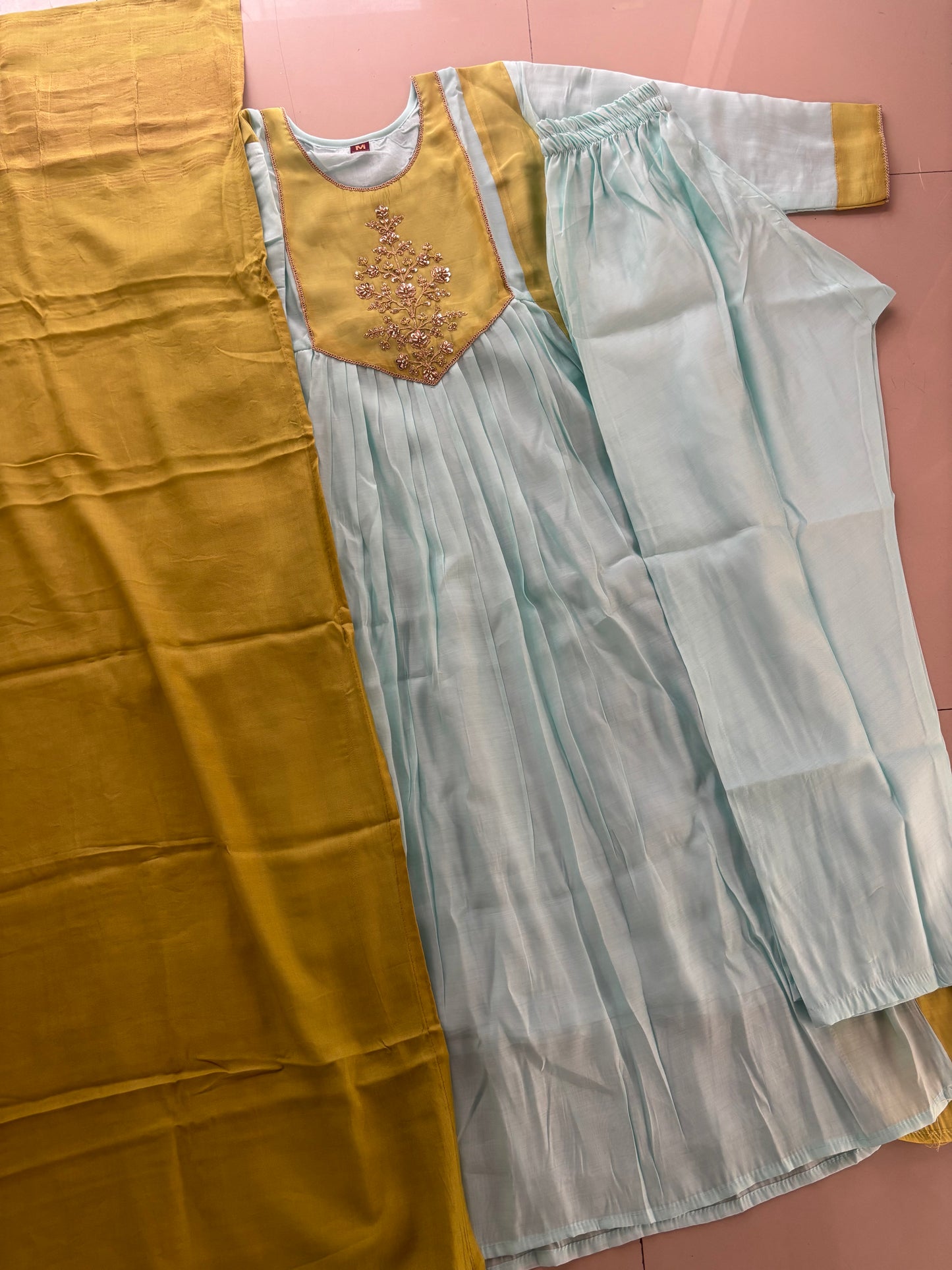 MD-275 "Pastel perfection meets a touch of gold. ✨ Absolutely loving the subtle contrast and intricate detailing on this ethnic set. Ready for the festive season! 🩵💛 #EthnicWear #OOTD #IndianFashion #AnarkaliSuit"