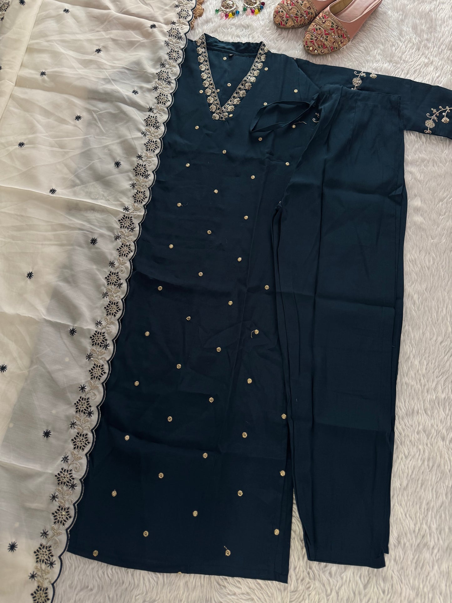 MD-213 "Elegance in every detail with embroidary work ✨ This deep purple suit with delicate floral embroidery is a perfect blend of grace and tradition