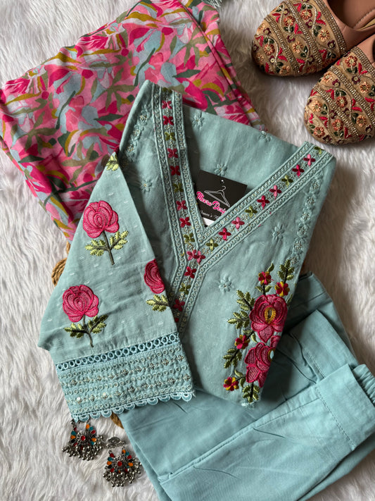 MD-178 This pastel grey suit set features delicate thread embroidery with vibrant pink floral motifs, paired with a colorful printed dupatta that adds a lively contrast. Perfect blend of subtle elegance and festive charm! ✨💗