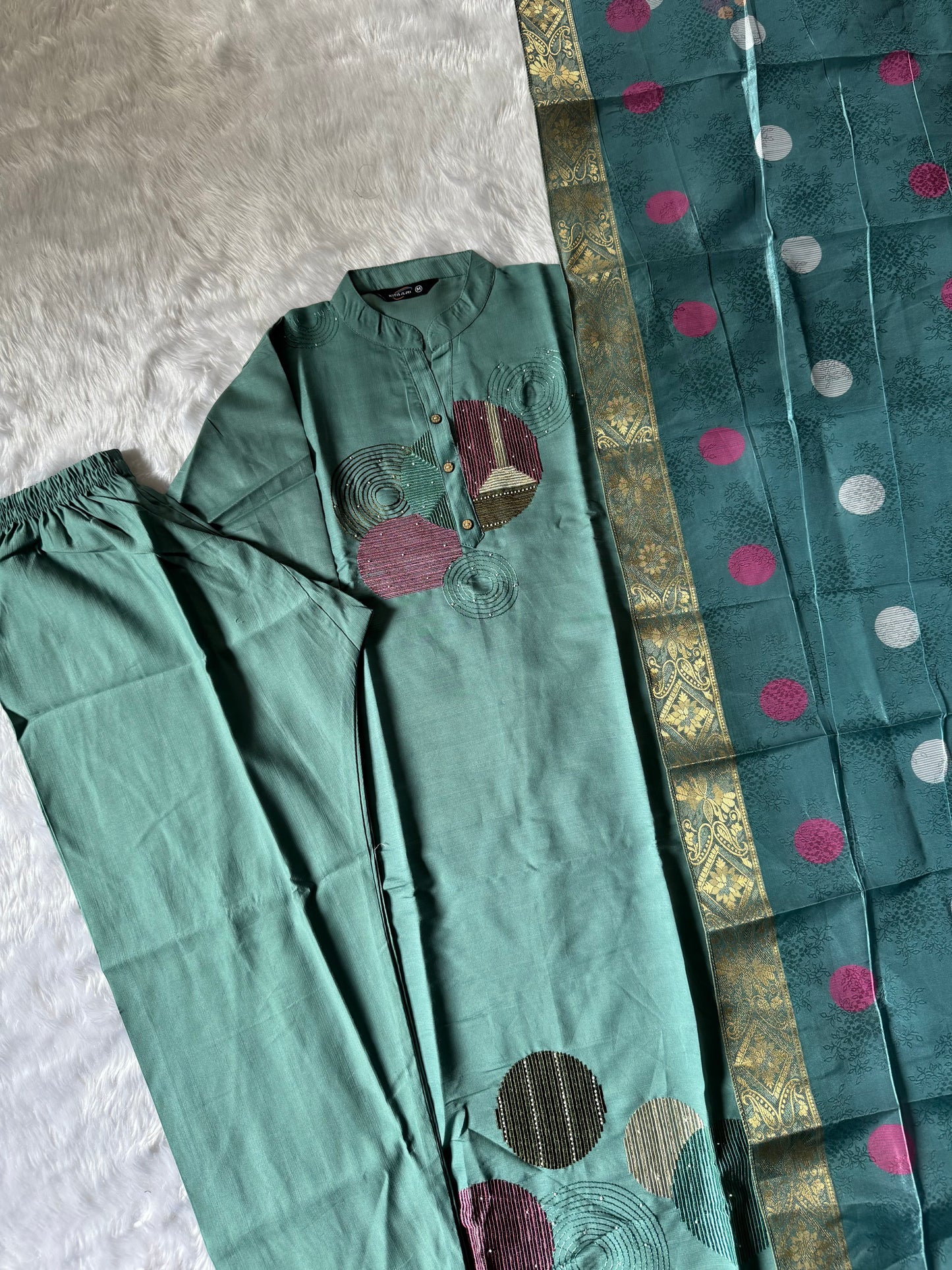 MD-186 This pastel green kurta set with abstract embroidery and a vibrant dupatta blends modern charm with traditional finesse — perfect for your effortless everyday style!