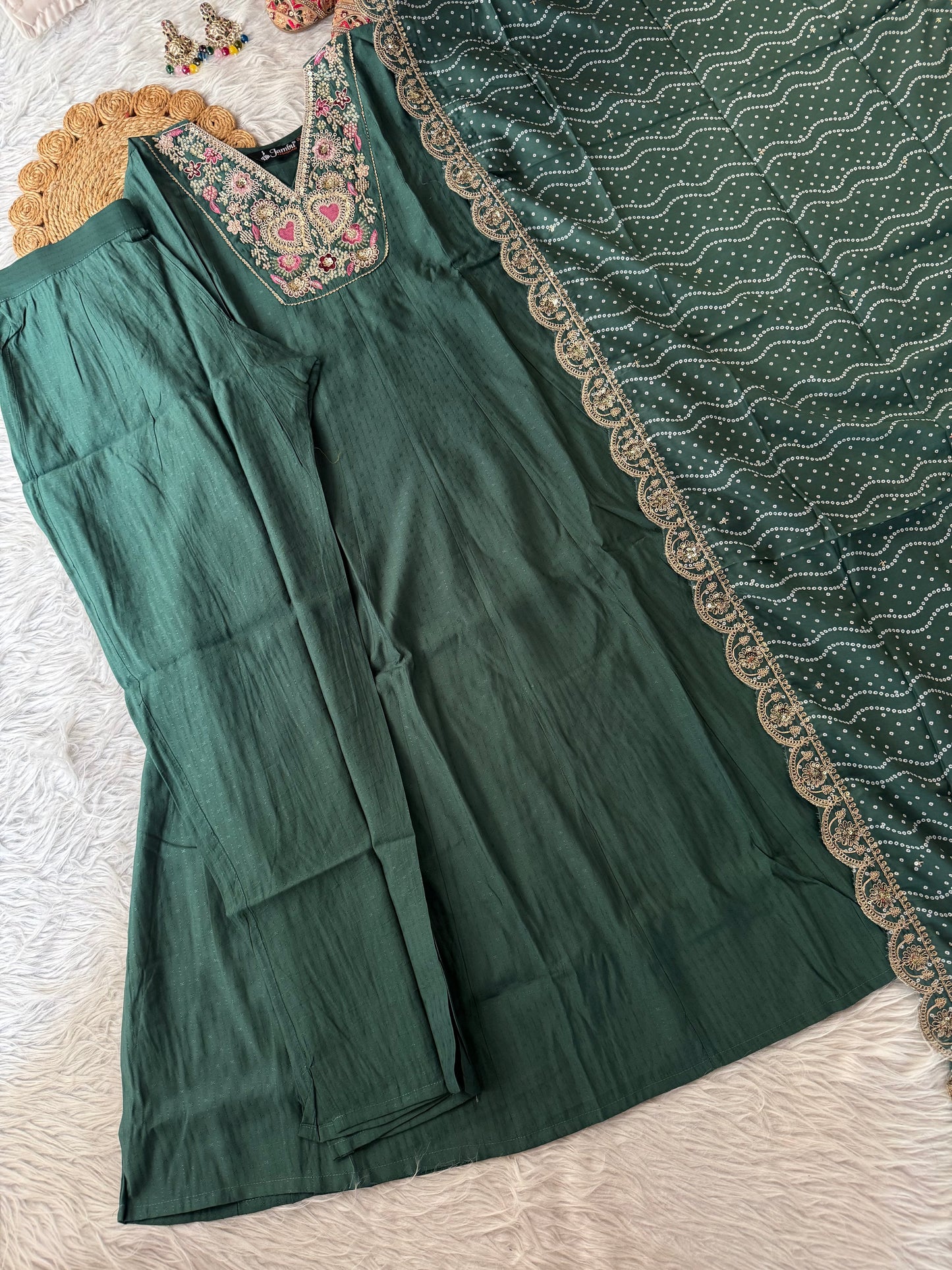MD-198 This suit set features intricate thread embroidery with heart motifs and a stunning bandhani dupatta edged in golden lace — perfect for festive moments and timeless grace."