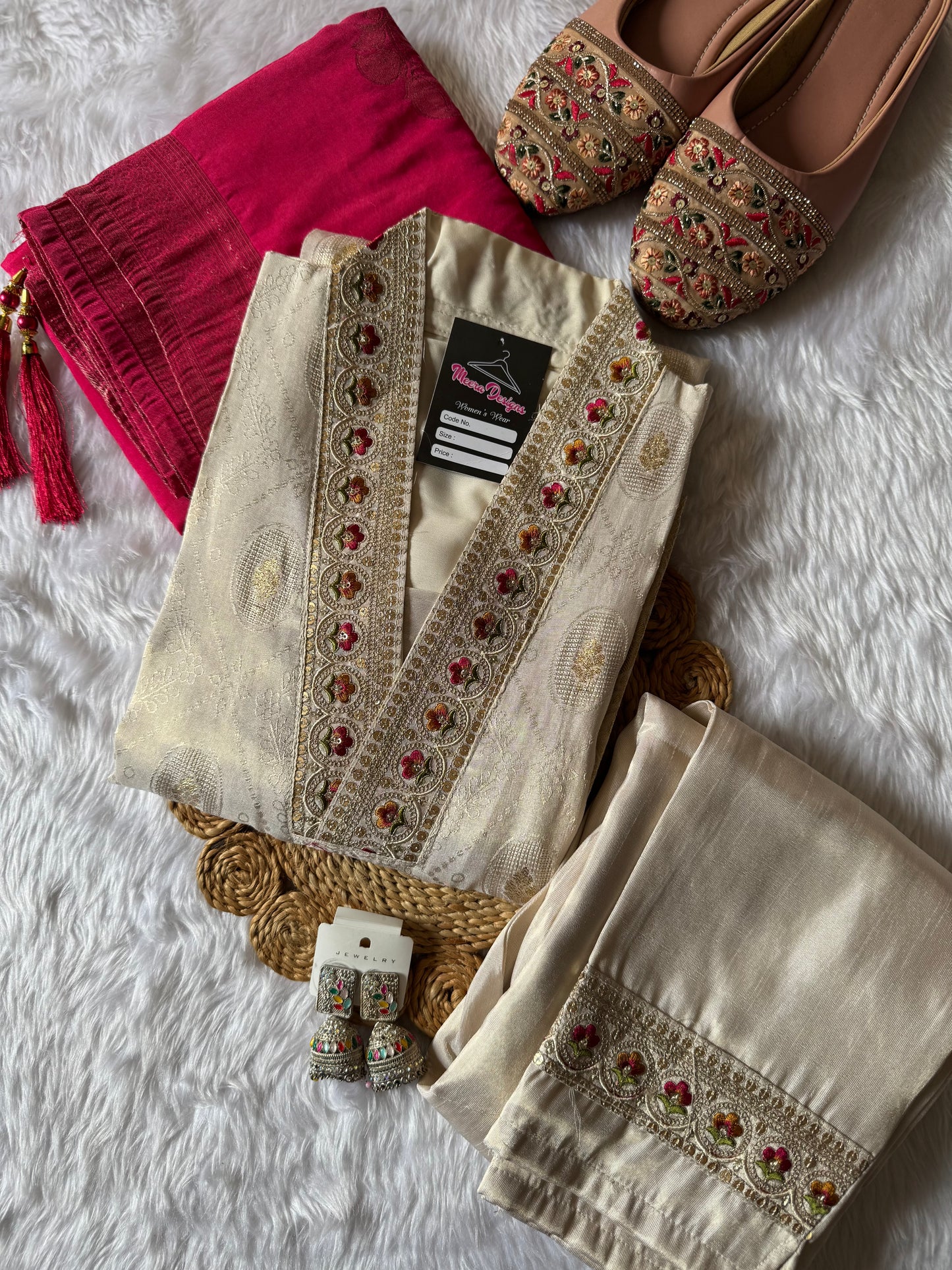 MD-172 This ivory silk set with intricate embroidery, paired with a bold magenta dupatta, is the perfect blend of tradition and timeless grace.