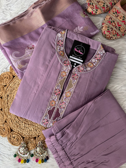 MD-200 A charming mauve kurta set adorned with intricate embroidery and a beautifully woven floral dupatta — perfect for elegant celebrations and timeless style.