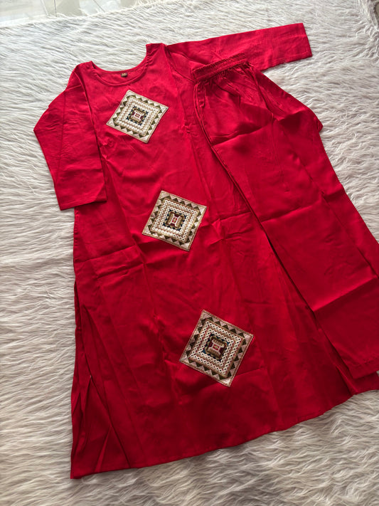 MD-234 This kurta set features striking geometric patchwork, blending traditional craftsmanship with a clean, contemporary silhouette. Perfect for those who appreciate the beauty of subtle details.