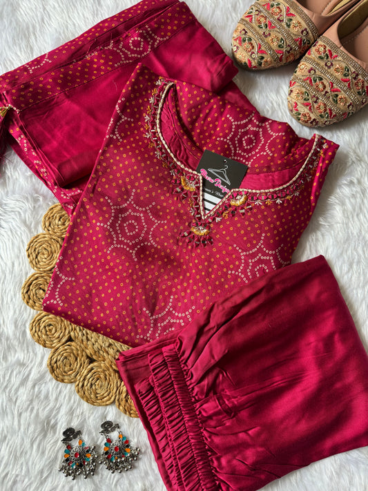 MD-180 Radiate festive charm in this vibrant Rani pink Bandhani suit set, adorned with traditional patterns and delicate mirror work — a perfect blend of elegance and heritage. ✨🌸