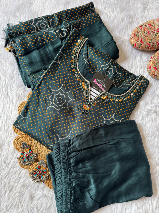 MD-181 this deep Bottle green printed suit set features subtle golden dot motifs with starburst patterns, paired with a plain bottom and dupatta. A perfect blend of tradition and grace for your everyday ethnic charm. ✨