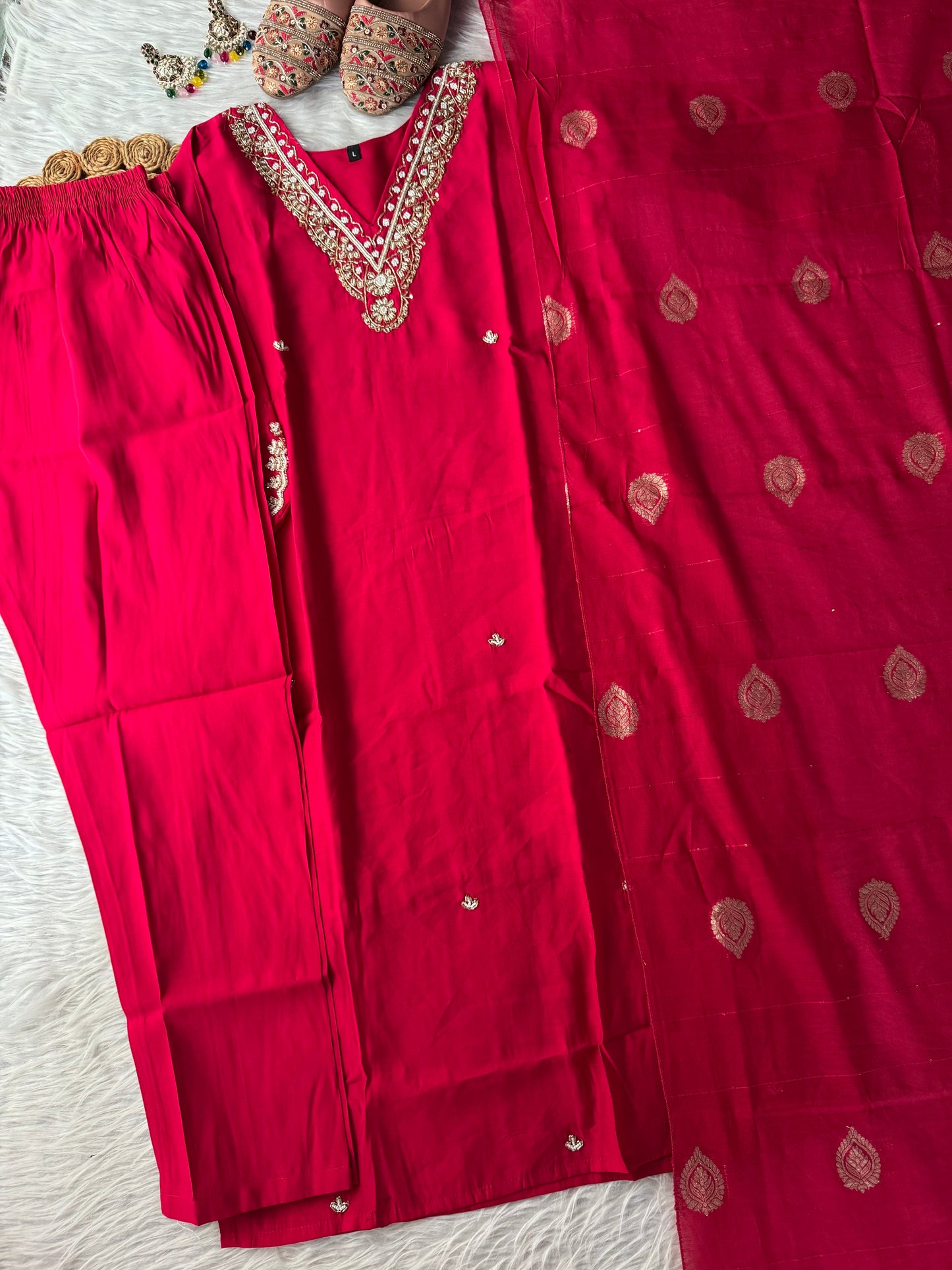 MD-196 "Radiate elegance in this rich  suit set, featuring delicate mirror work on the neckline, subtle embroidery on the kurta, and a beautifully woven dupatta — perfect for festive charm and graceful gatherings."