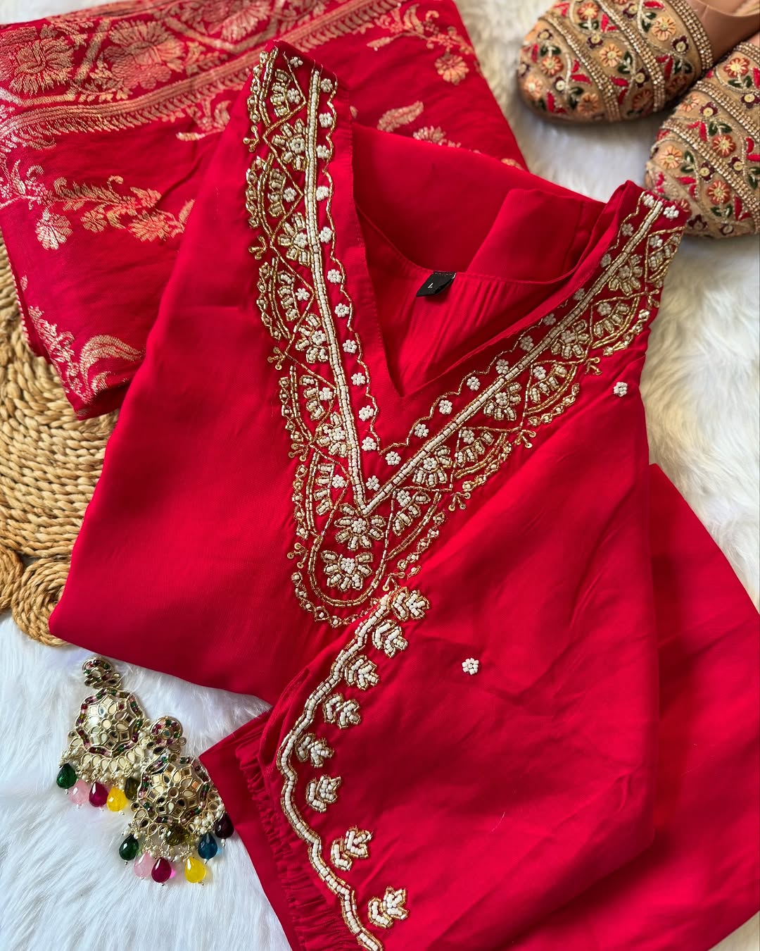 MD-196 "Radiate elegance in this rich  suit set, featuring delicate mirror work on the neckline, subtle embroidery on the kurta, and a beautifully woven dupatta — perfect for festive charm and graceful gatherings."