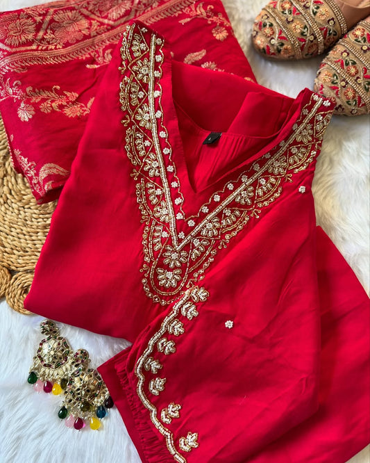 MD-196 "Radiate elegance in this rich  suit set, featuring delicate mirror work on the neckline, subtle embroidery on the kurta, and a beautifully woven dupatta — perfect for festive charm and graceful gatherings."