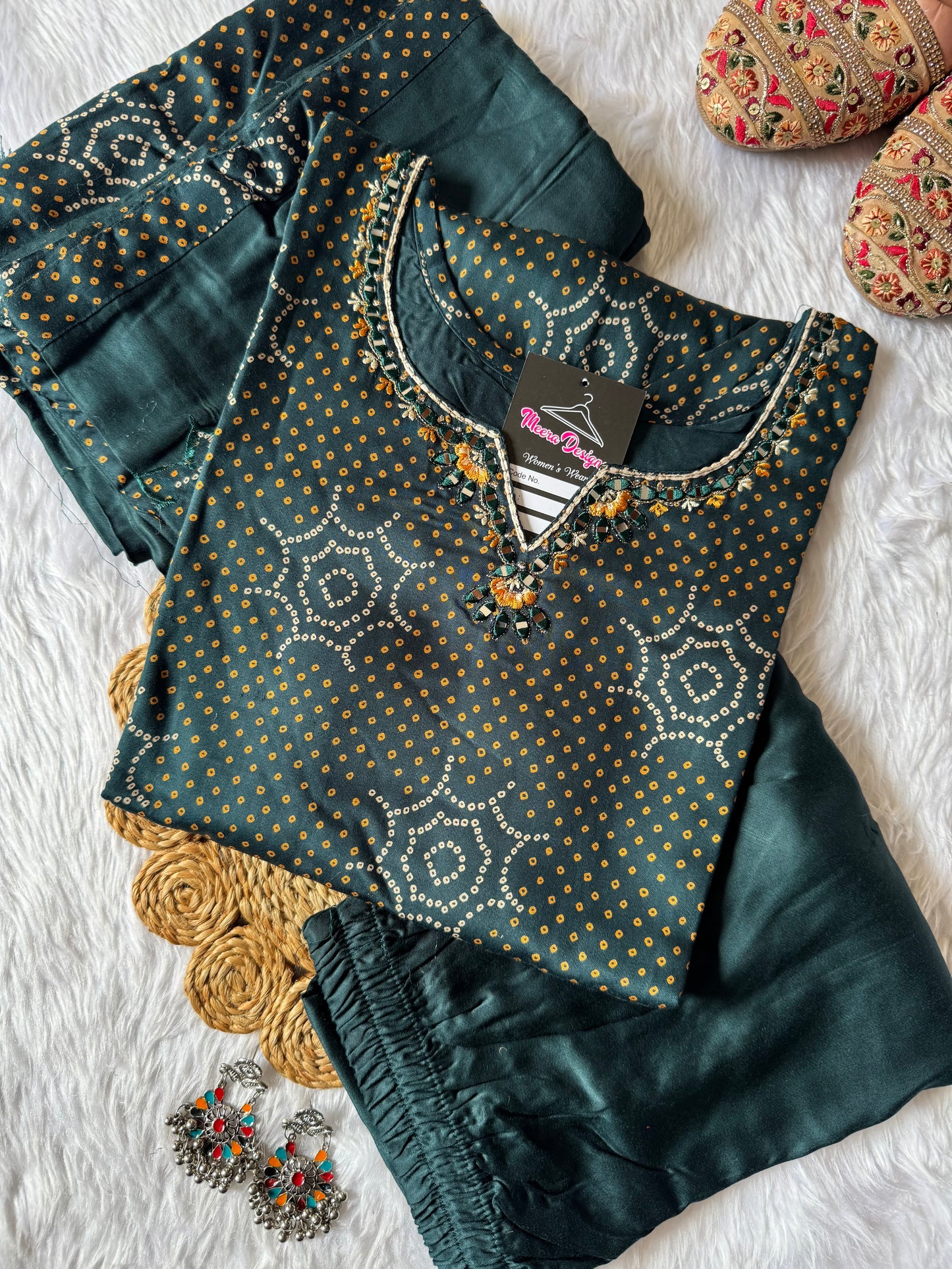 MD-181 this deep Bottle green printed suit set features subtle golden dot motifs with starburst patterns, paired with a plain bottom and dupatta. A perfect blend of tradition and grace for your everyday ethnic charm. ✨