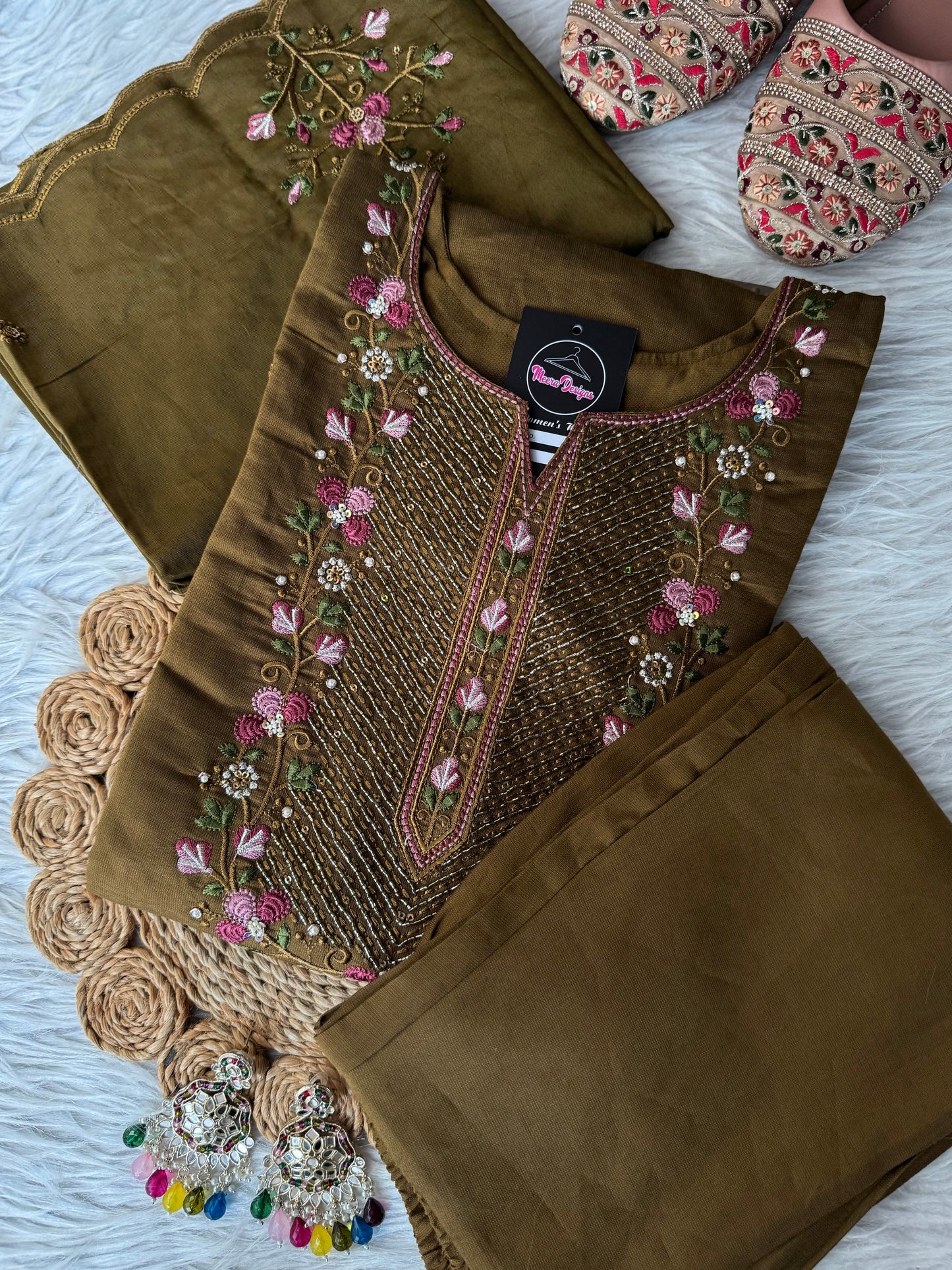 MD-203
"Royal elegance in every stitch – deep plum adorned with delicate floral embroidery for a timeless festive charm."