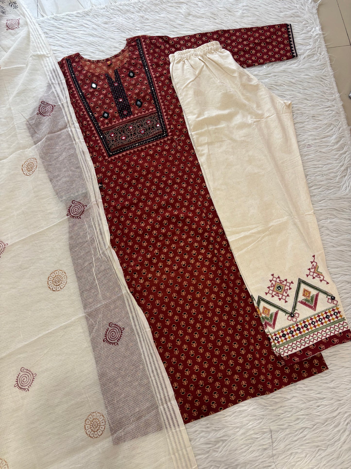 MD-274 "Traditional charm meets modern comfort. 🌟 Loving the details on this printed kurta and crisp off-white coordinates—perfect for daywear or festive gatherings!"