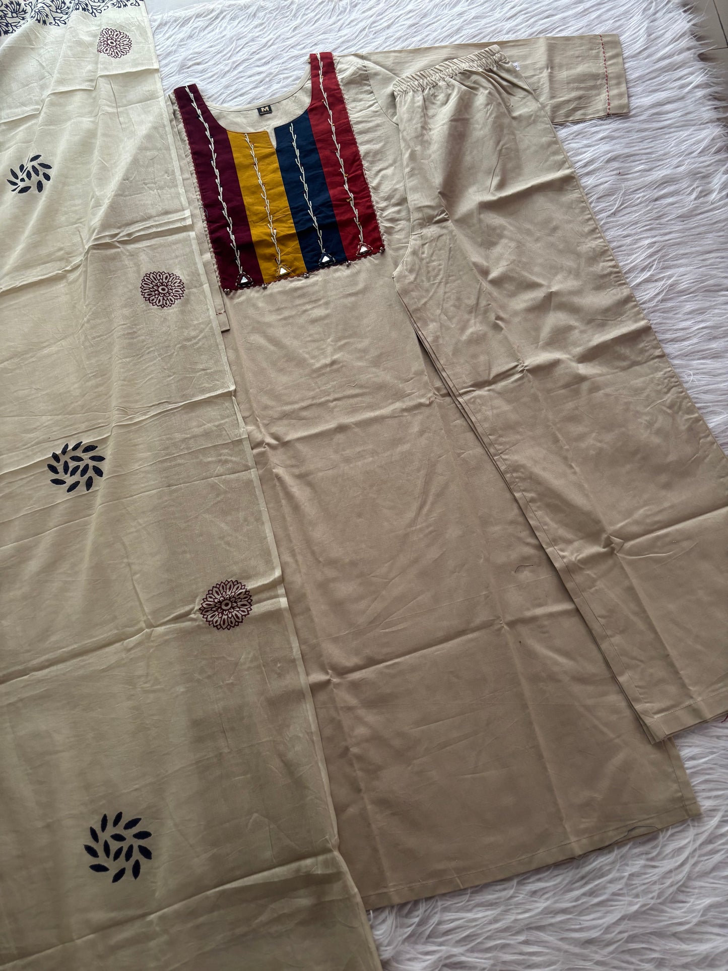 MD-231 This stylish three-piece ethnic set offers a blend of neutral tones and vibrant accents, making it a versatile choice for both casual outings and festive gatherings.