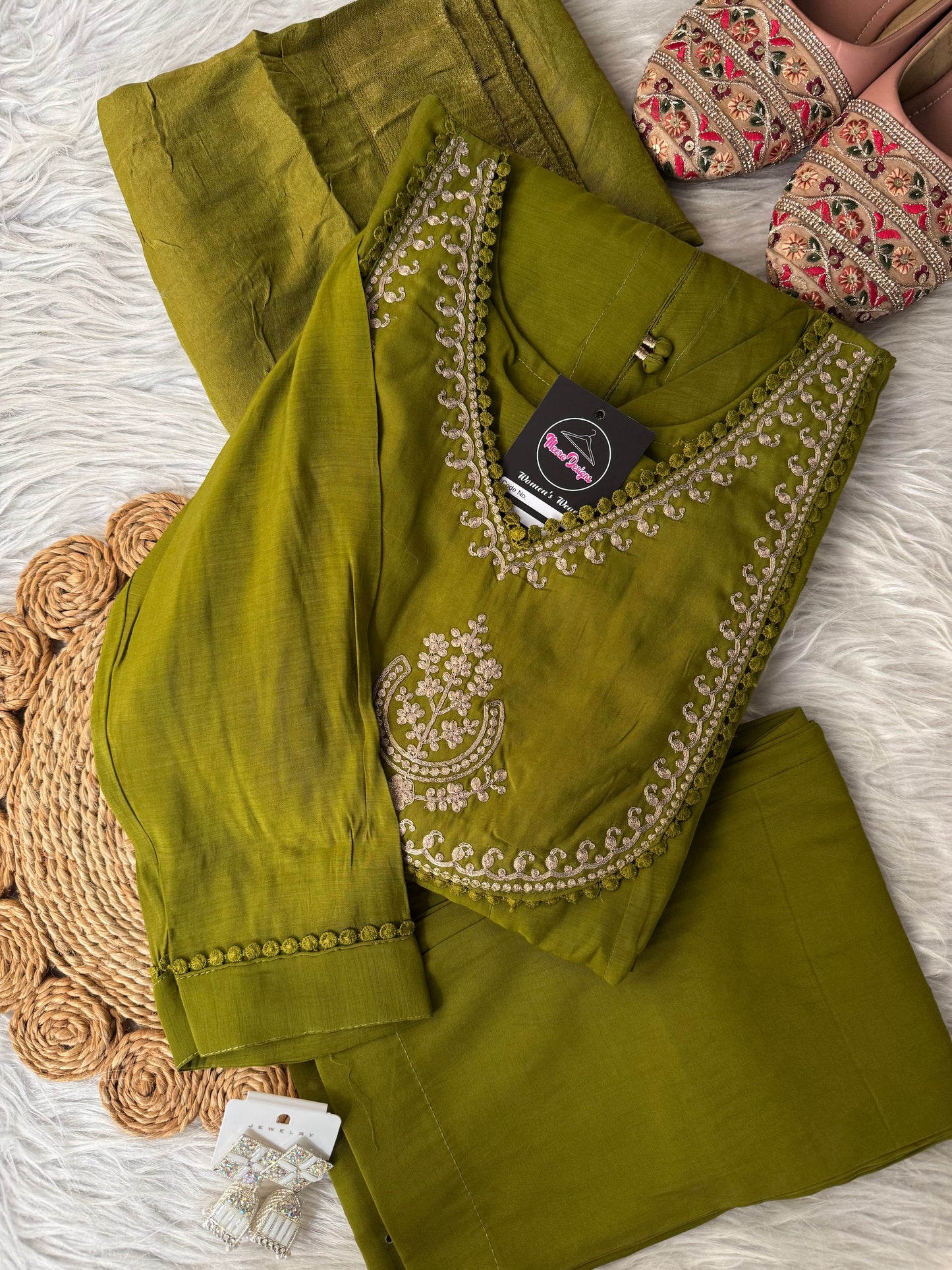 MD-201 Elegant deep teal ethnic ensemble featuring a flared kurta with delicate mirror buttons and intricate golden embroidery on the neckline, paired with matching pants and a rich, woven dupatta adorned with subtle floral motifs. Perfect for festive occ