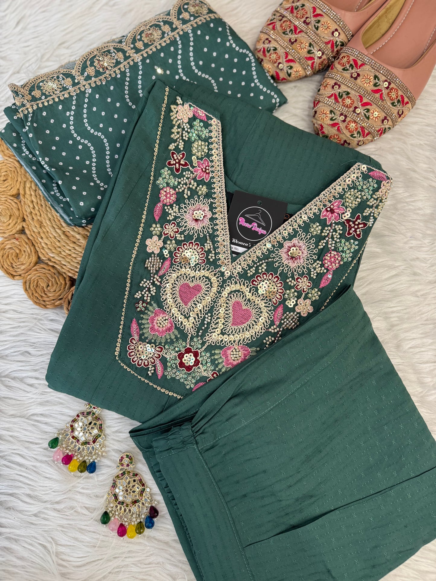 MD-198 This suit set features intricate thread embroidery with heart motifs and a stunning bandhani dupatta edged in golden lace — perfect for festive moments and timeless grace."