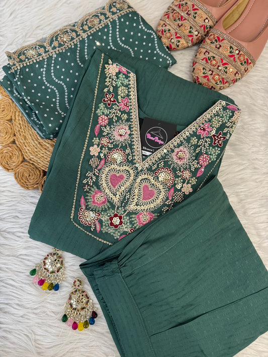 MD-198 This suit set features intricate thread embroidery with heart motifs and a stunning bandhani dupatta edged in golden lace — perfect for festive moments and timeless grace."
