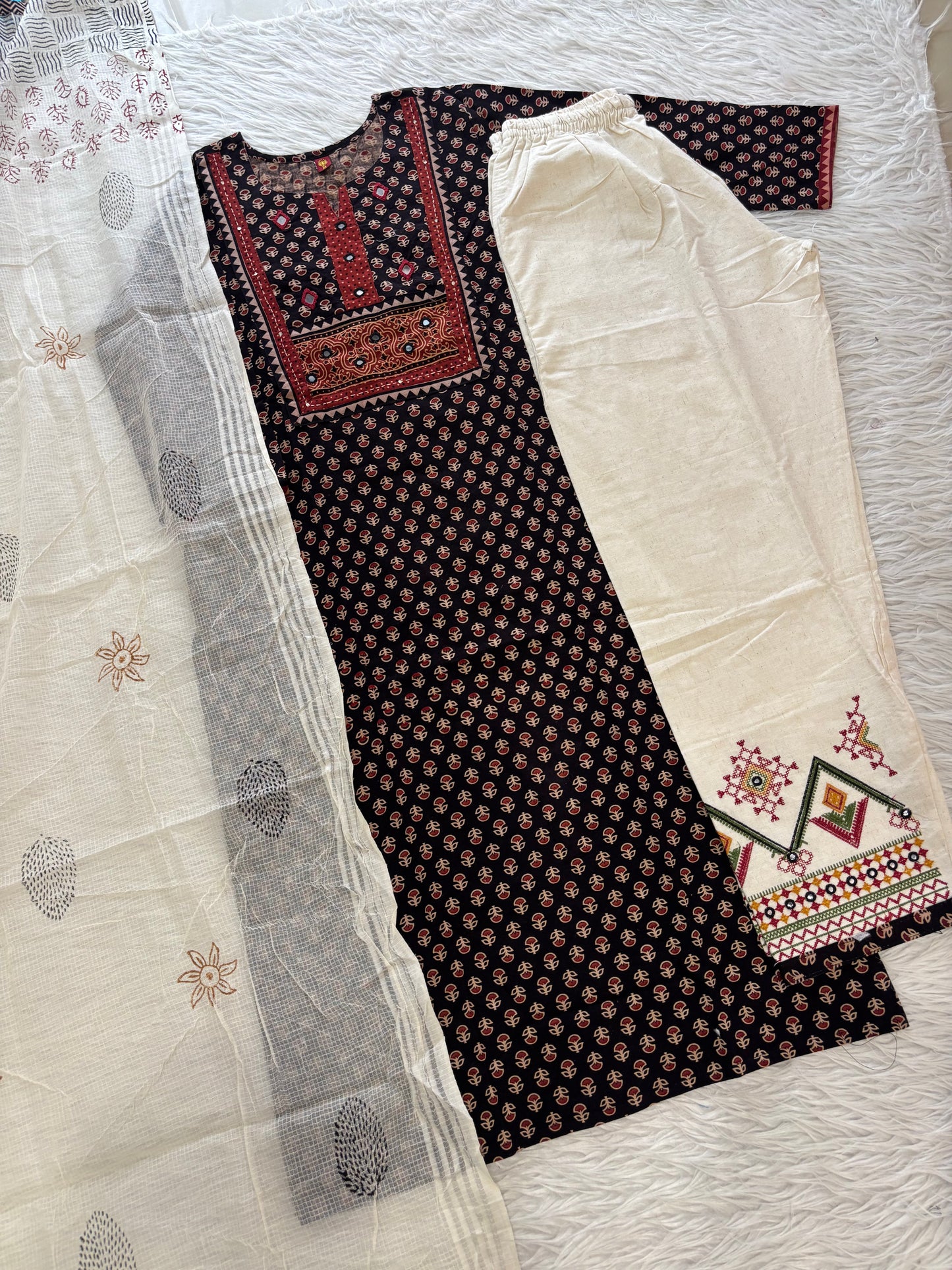 MD-274 "Traditional charm meets modern comfort. 🌟 Loving the details on this printed kurta and crisp off-white coordinates—perfect for daywear or festive gatherings!"