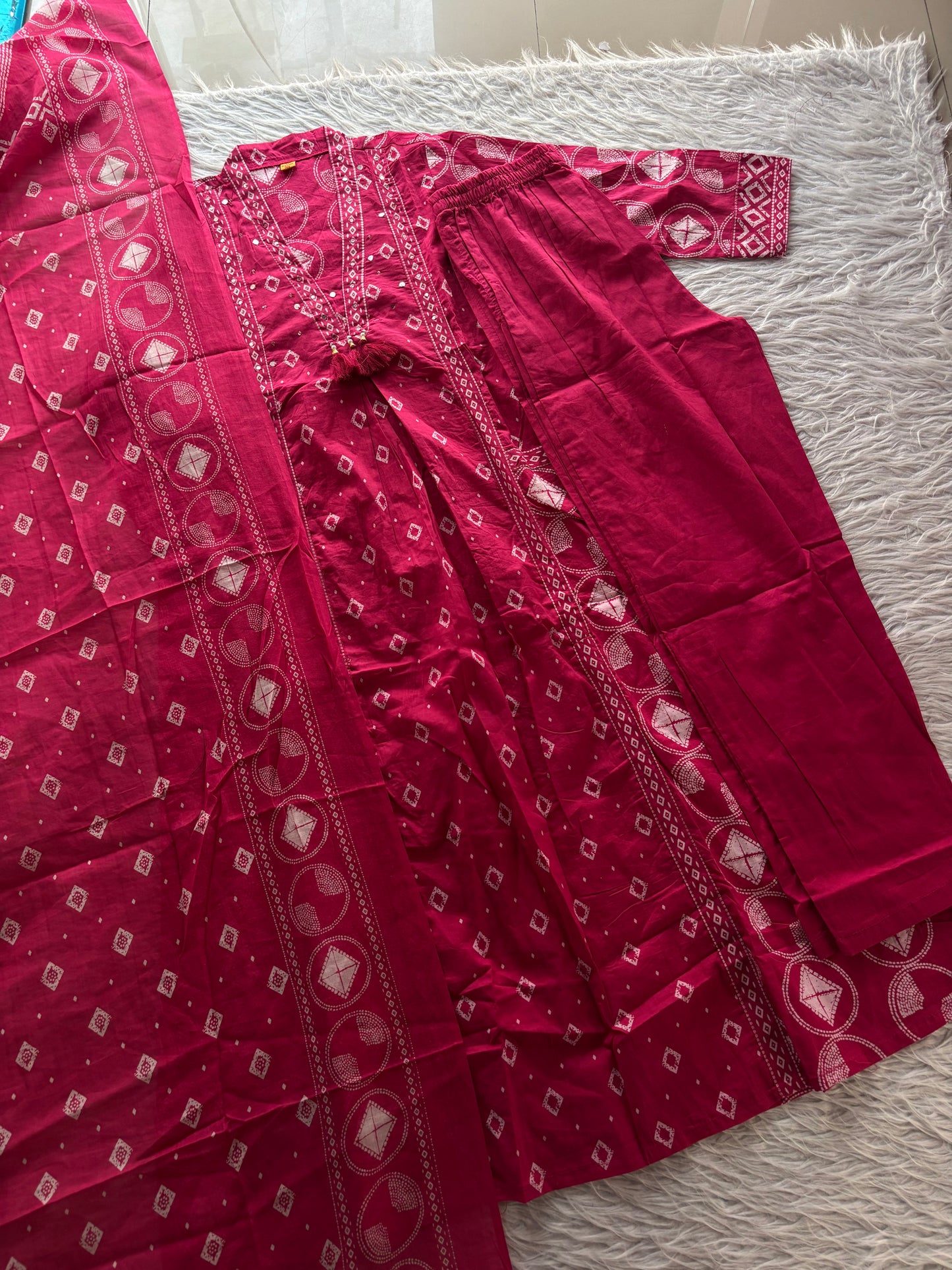 MD-267 Captions for Your Berry  Bandhani Set
Here are a few caption options tailored for different social media vibes, highlighting the intricate mirror work and classic Bandhani print of this outfit.