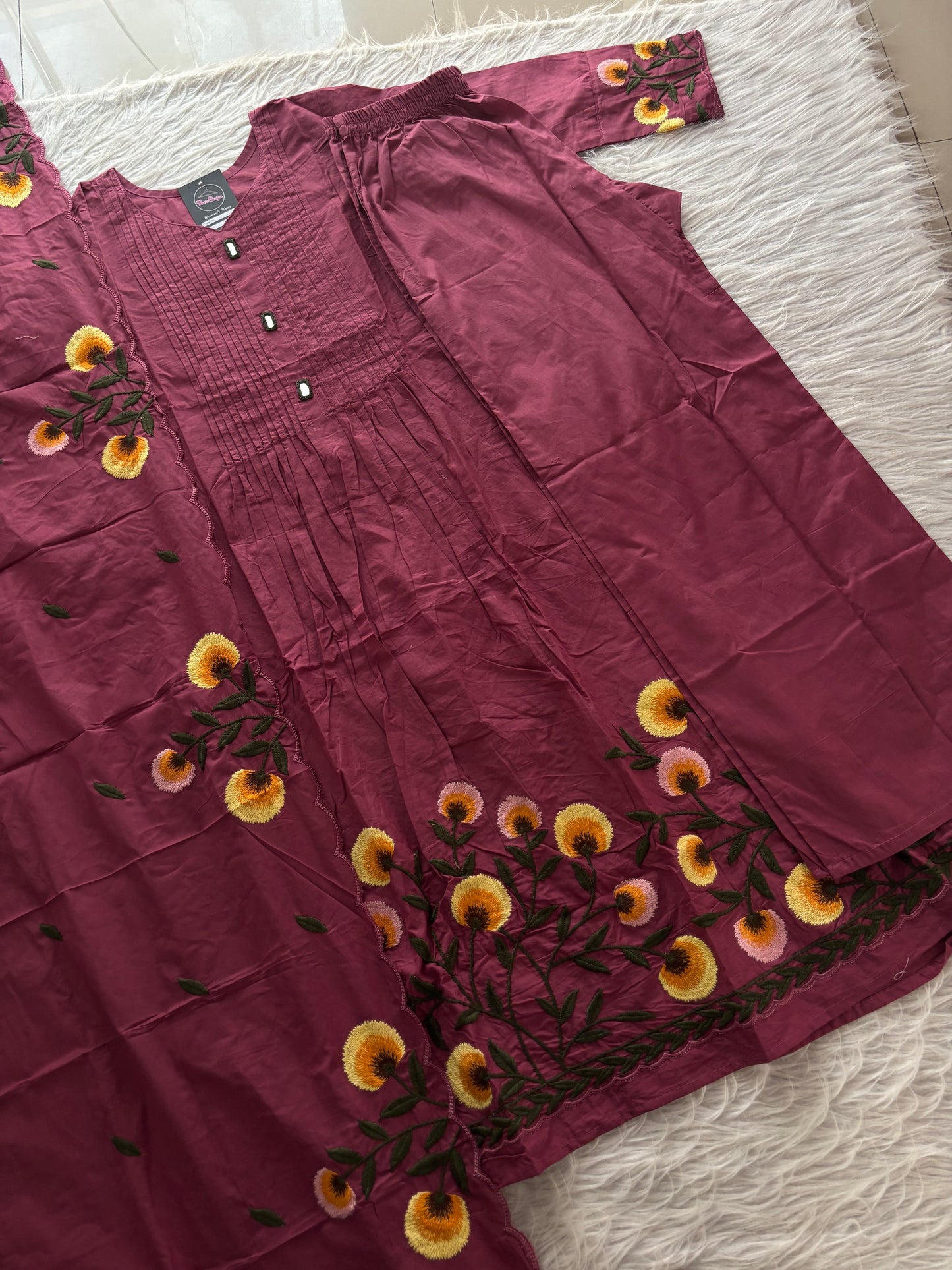 MD-257 That is a lovely three-piece ethnic set in a rich plum or deep mauve shade. Here is a breakdown of the details for your caption: