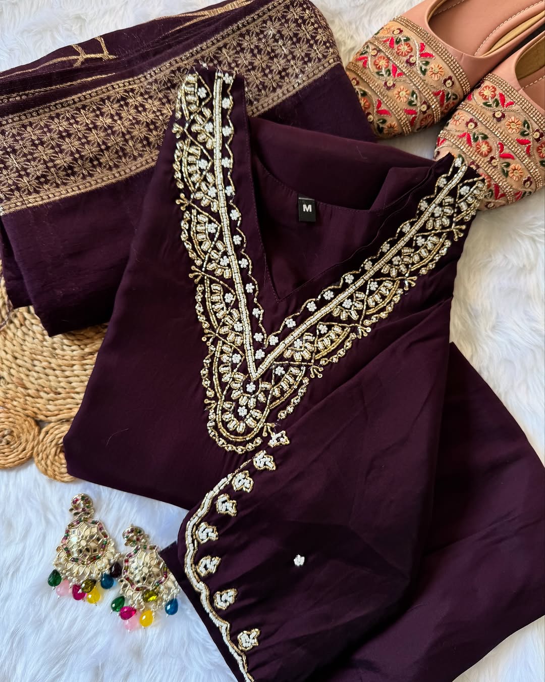 MD-196 "Radiate elegance in this rich  suit set, featuring delicate mirror work on the neckline, subtle embroidery on the kurta, and a beautifully woven dupatta — perfect for festive charm and graceful gatherings."