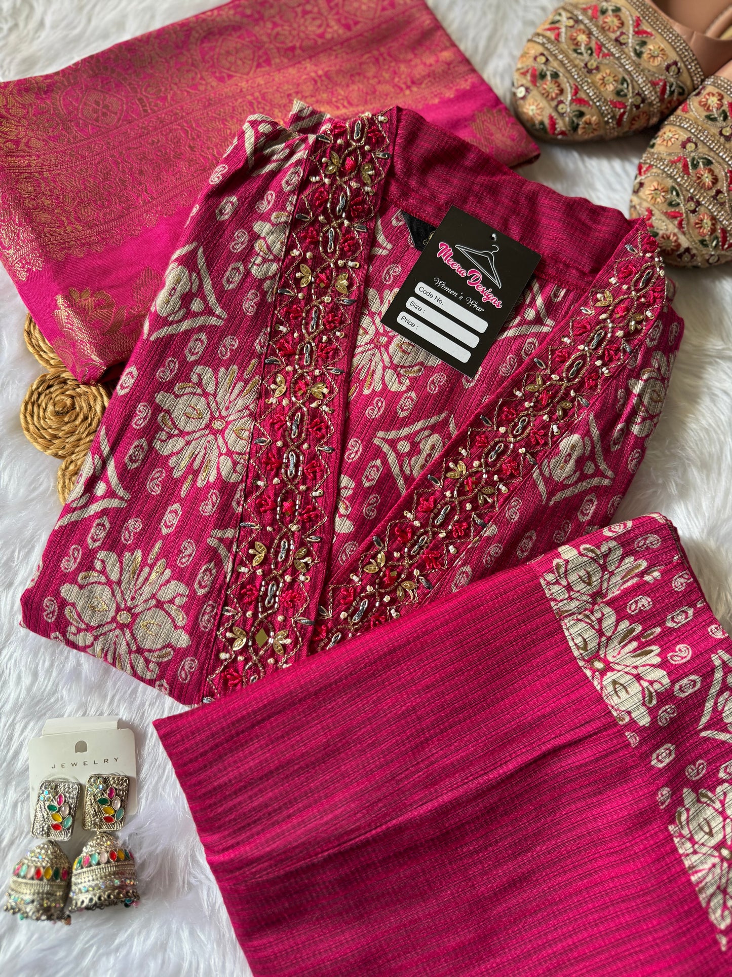 MD-171 "Regal Rose Banarasi Ensemble"

This elegant design features a rich magenta kurta adorned with intricate golden motifs, paired with a matching pleated bottom and a luxurious silk dupatta — perfect for festive elegance and timeless tradition.