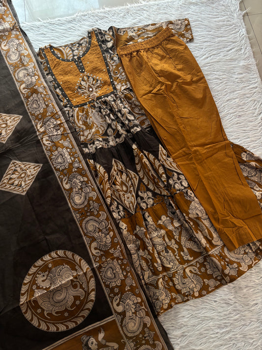 MD-273 "Embracing timeless tradition with a modern twist. Loving the rich hues, intricate Kalamkari-inspired prints, and delicate mirror work on this gorgeous tiered suit set. ✨💛"