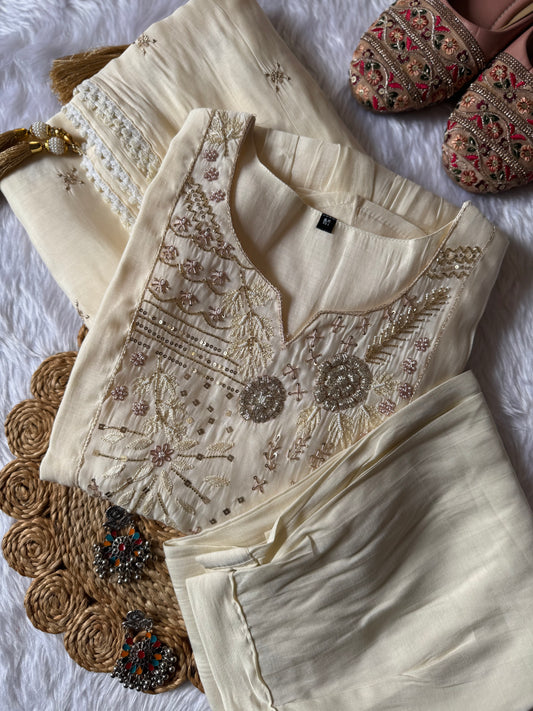 MD-184 This elegant suit set features delicate thread embroidery and mirror accents, paired with a soft, flowy dupatta — perfect for timeless festive charm.