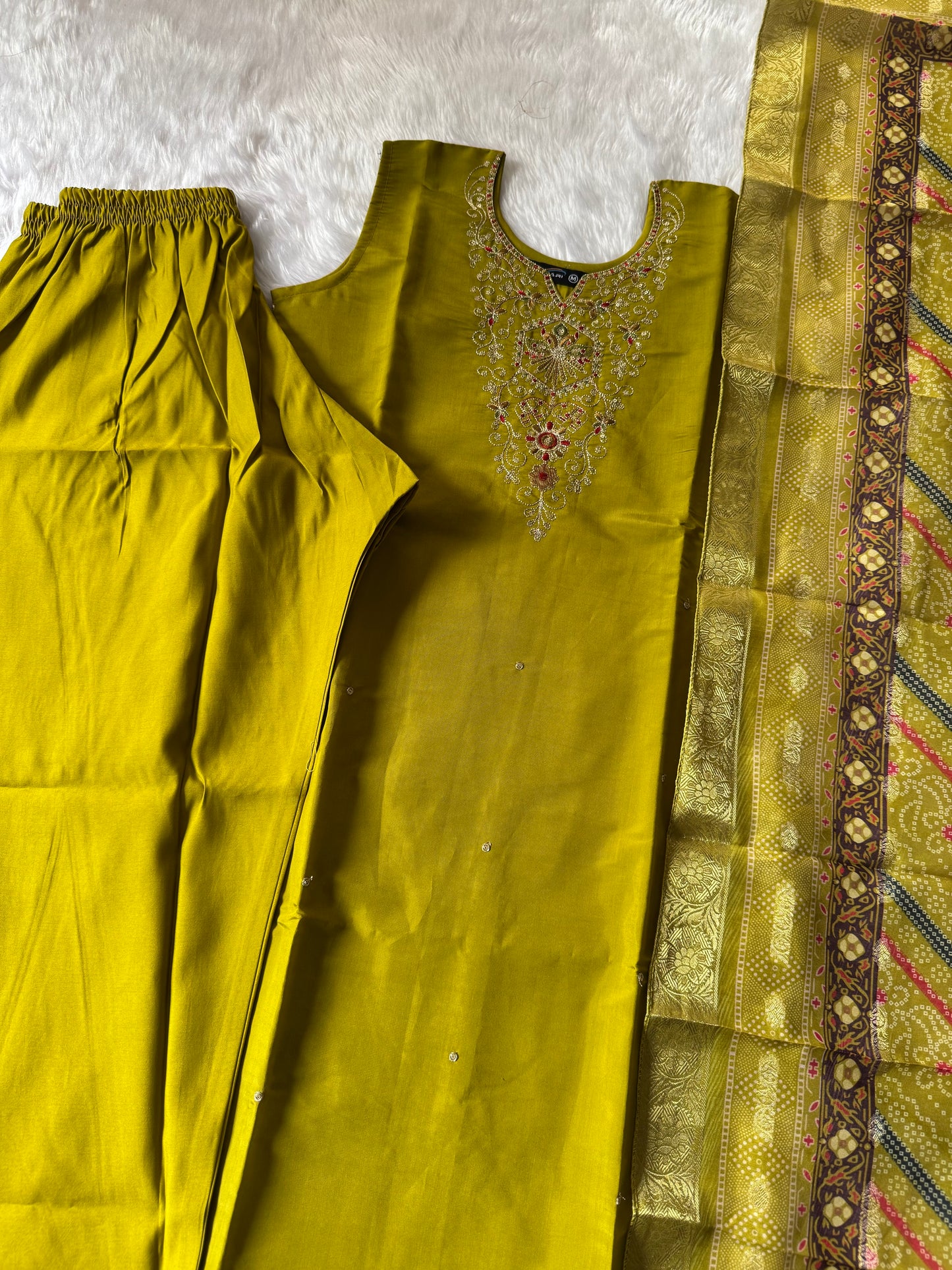 MD-187 this mustard green suit set features intricate neckline embroidery paired with a rich Banarasi dupatta, making it an exquisite choice for festive occasions and celebrations. ✨💛