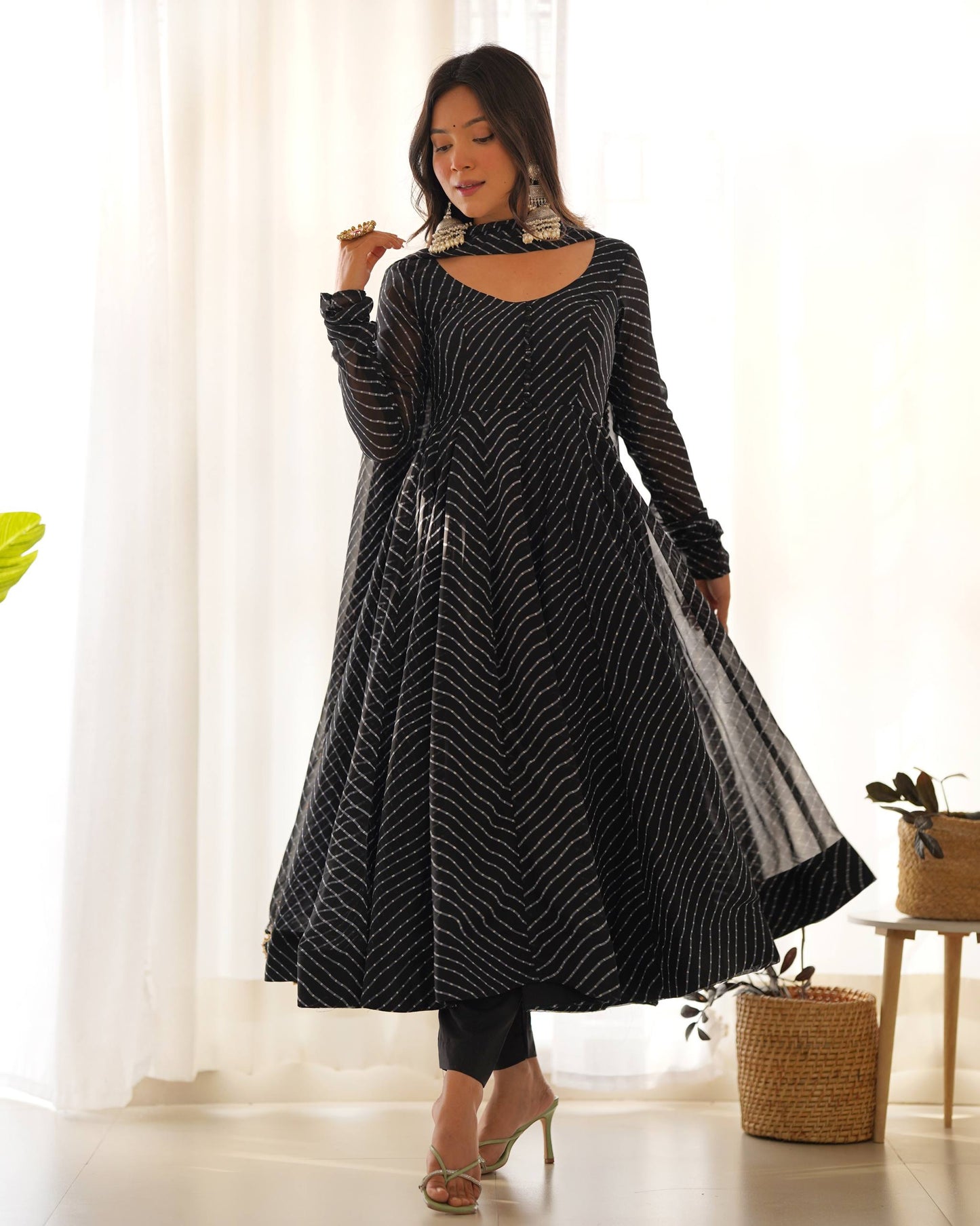 MD-246 Step into a world of grace and sophistication with this stunning teal Leheriya-patterned Anarkali set. Perfect for festive celebrations or an elegant evening out, this ensemble strikes the perfect balance between traditional craftsmanship and moder