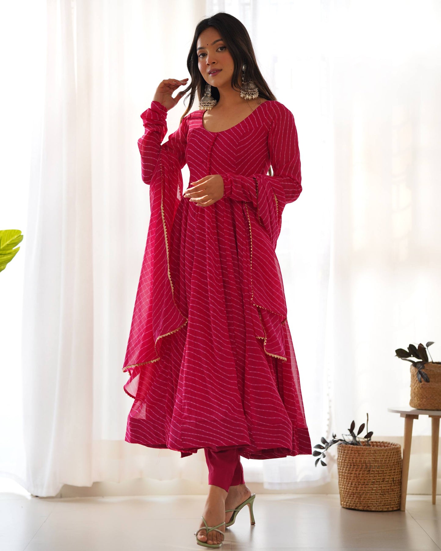 MD-246 Step into a world of grace and sophistication with this stunning teal Leheriya-patterned Anarkali set. Perfect for festive celebrations or an elegant evening out, this ensemble strikes the perfect balance between traditional craftsmanship and moder