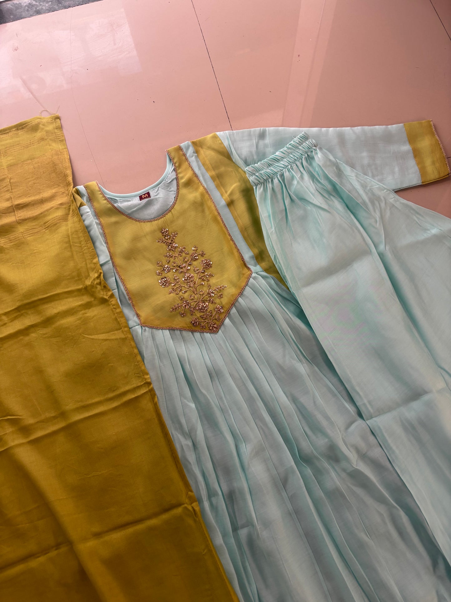 MD-275 "Pastel perfection meets a touch of gold. ✨ Absolutely loving the subtle contrast and intricate detailing on this ethnic set. Ready for the festive season! 🩵💛 #EthnicWear #OOTD #IndianFashion #AnarkaliSuit"