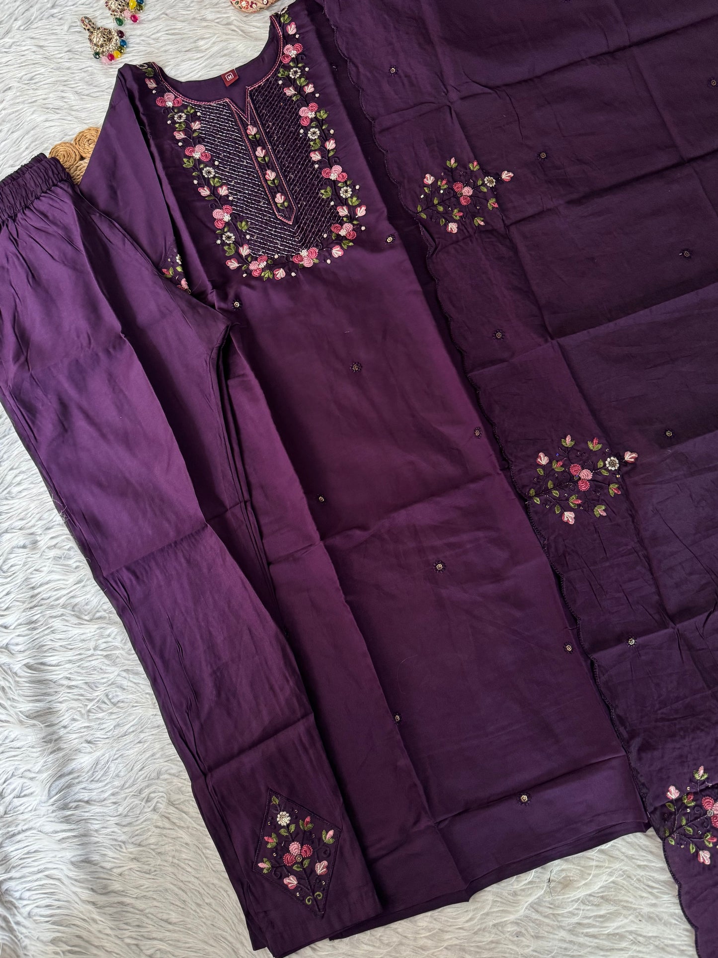 MD-203
"Royal elegance in every stitch – deep plum adorned with delicate floral embroidery for a timeless festive charm."