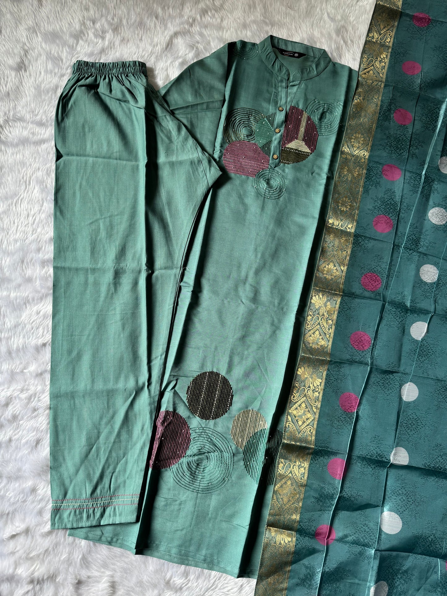 MD-186 This pastel green kurta set with abstract embroidery and a vibrant dupatta blends modern charm with traditional finesse — perfect for your effortless everyday style!