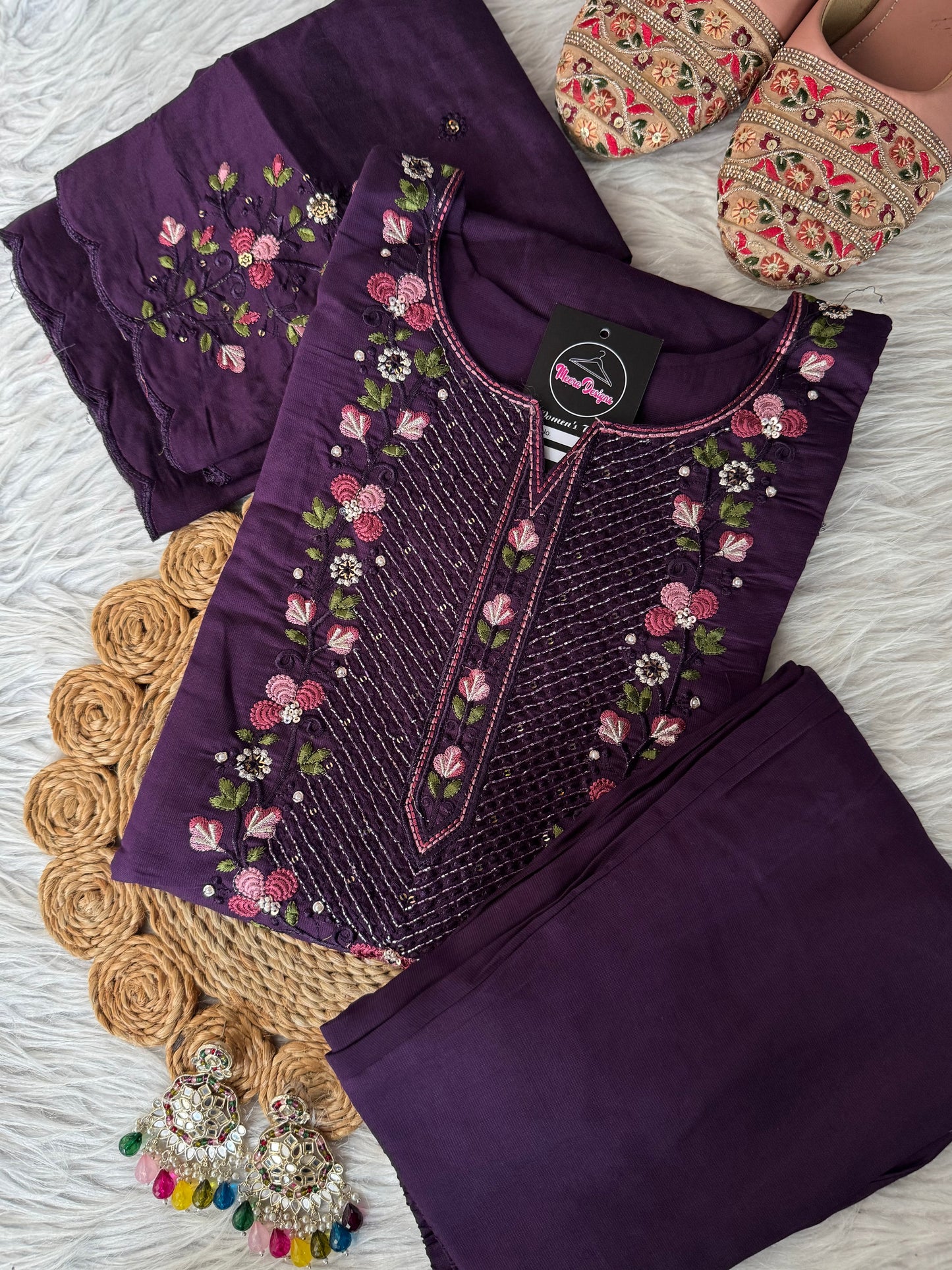 MD-203
"Royal elegance in every stitch – deep plum adorned with delicate floral embroidery for a timeless festive charm."