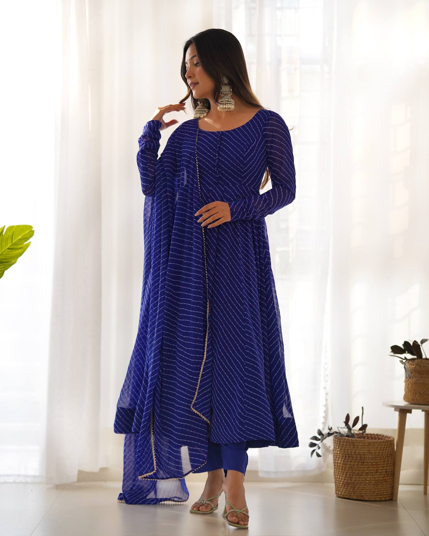 MD-246 Step into a world of grace and sophistication with this stunning teal Leheriya-patterned Anarkali set. Perfect for festive celebrations or an elegant evening out, this ensemble strikes the perfect balance between traditional craftsmanship and moder