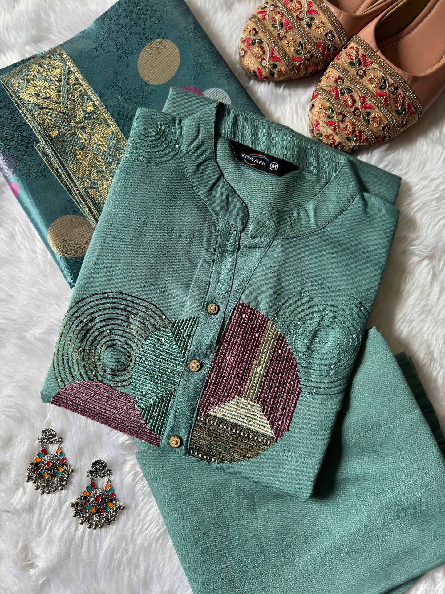 MD-186 This pastel green kurta set with abstract embroidery and a vibrant dupatta blends modern charm with traditional finesse — perfect for your effortless everyday style!