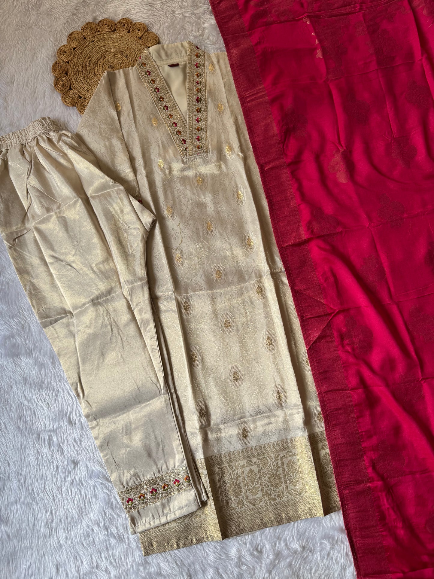 MD-172 This ivory silk set with intricate embroidery, paired with a bold magenta dupatta, is the perfect blend of tradition and timeless grace.