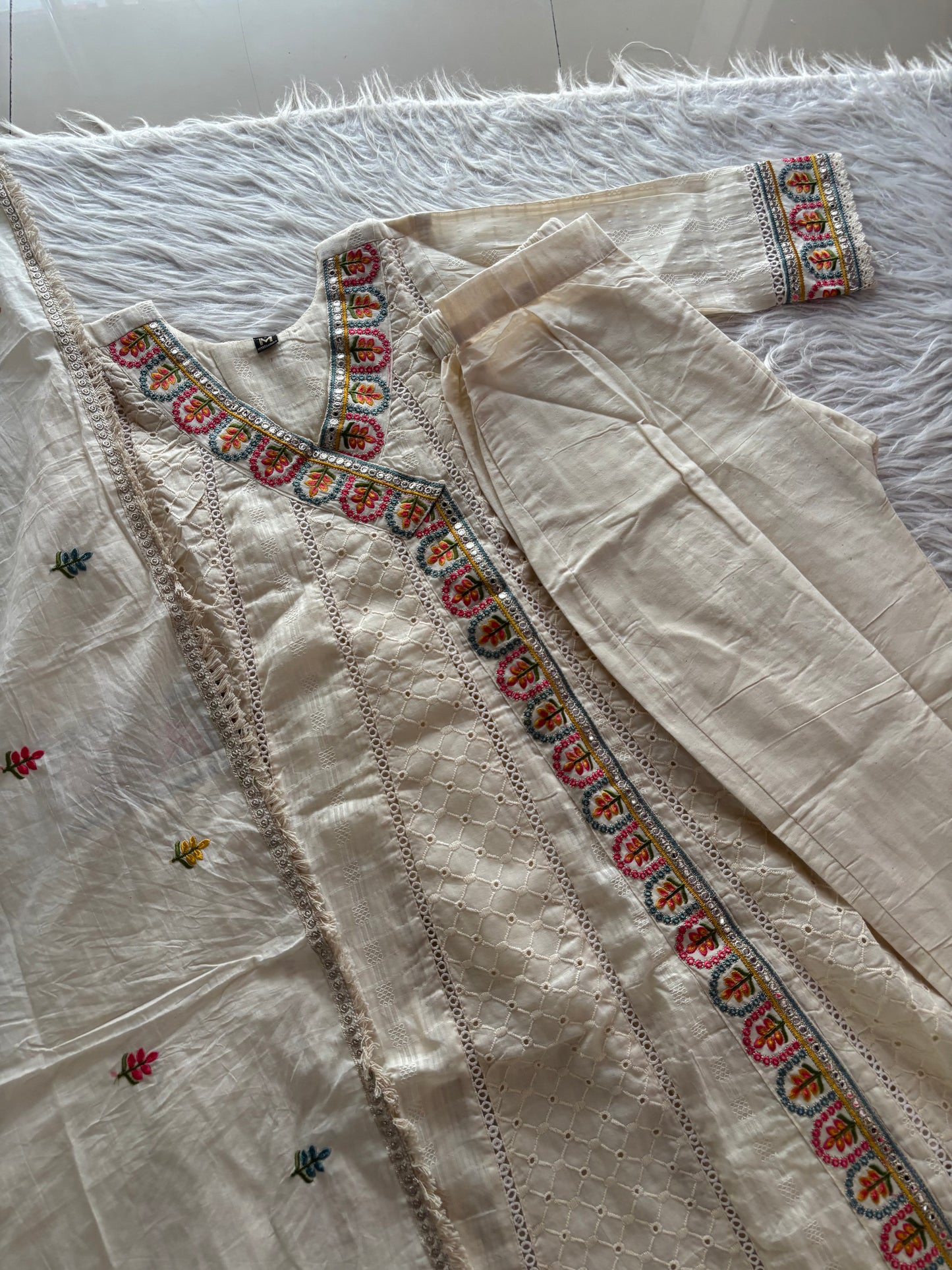 MD-248 Elegant Ethnic Ensembles
Here are a few caption options for this ivory suit set, ranging from classic to trendy: