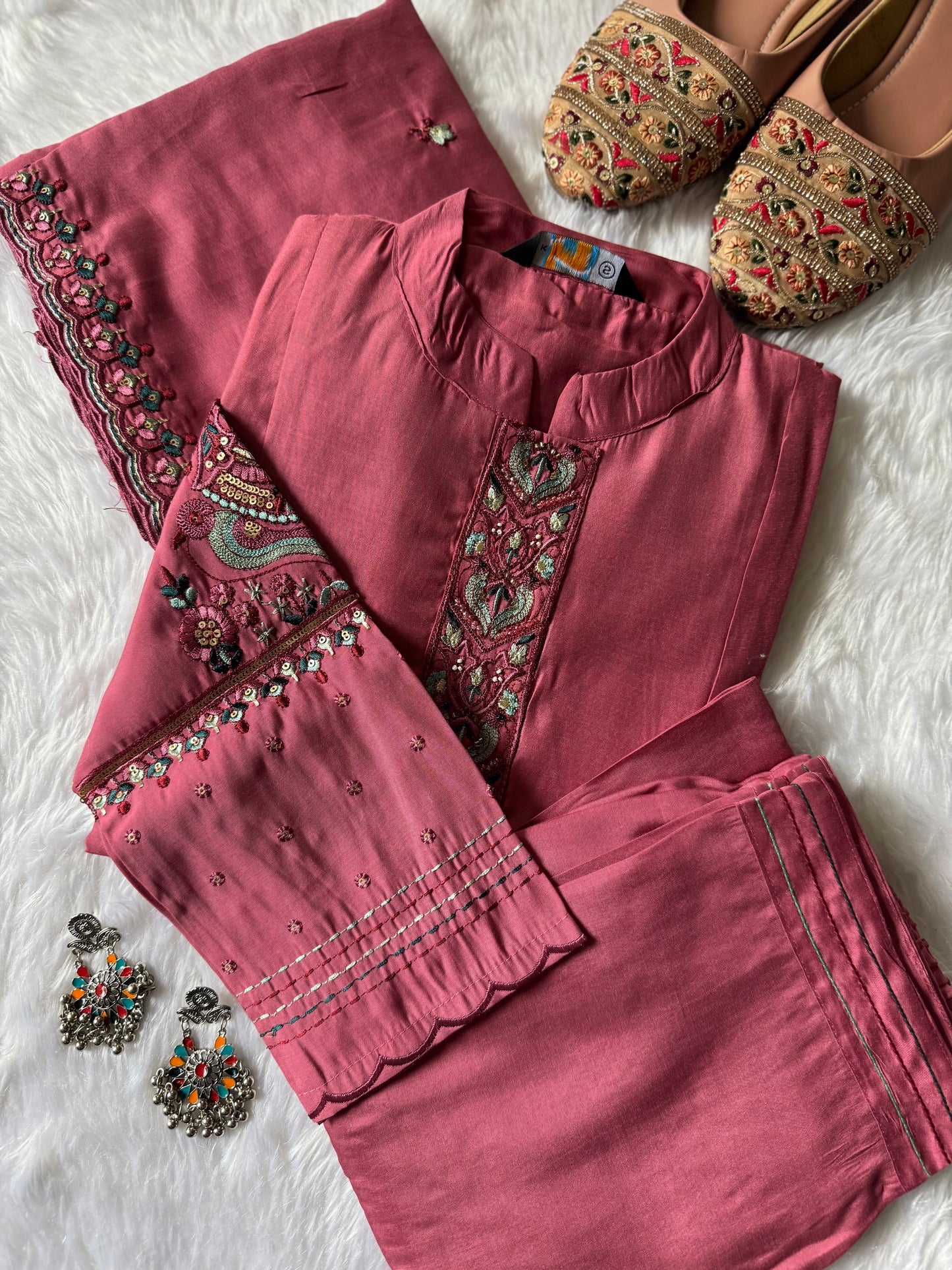 MD-188 A soft kurta set adorned with intricate thread embroidery and a delicately detailed dupatta. Perfect for effortless elegance in every season. ✨