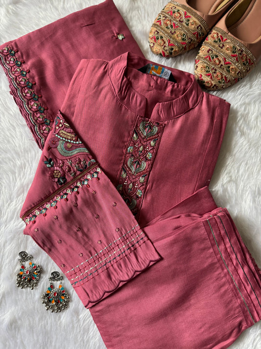 MD-188 A soft kurta set adorned with intricate thread embroidery and a delicately detailed dupatta. Perfect for effortless elegance in every season. ✨
