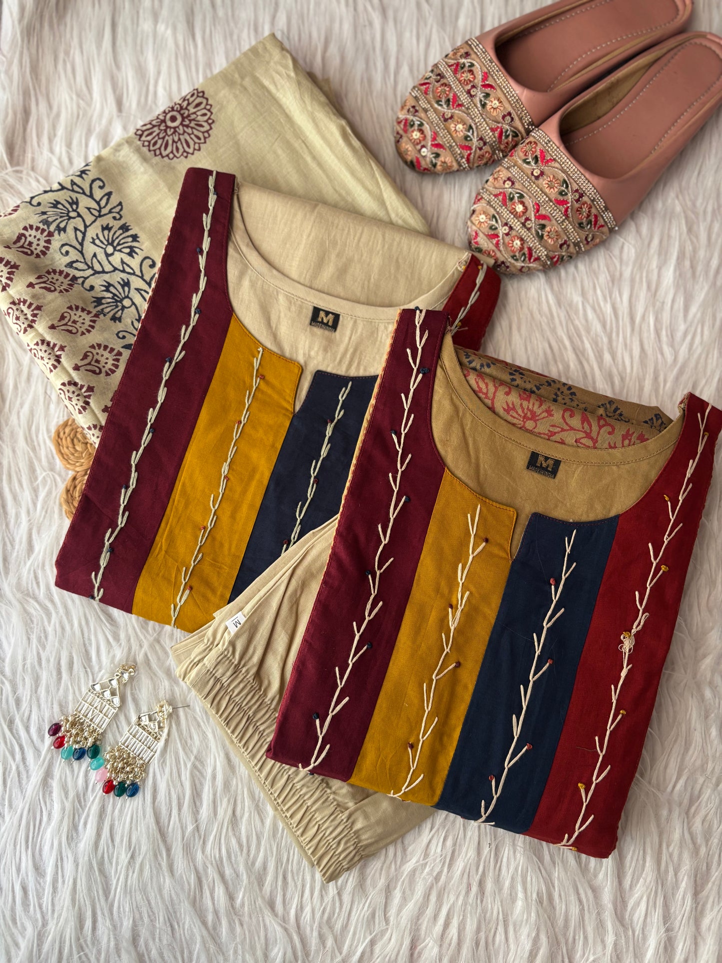 MD-231 This stylish three-piece ethnic set offers a blend of neutral tones and vibrant accents, making it a versatile choice for both casual outings and festive gatherings.