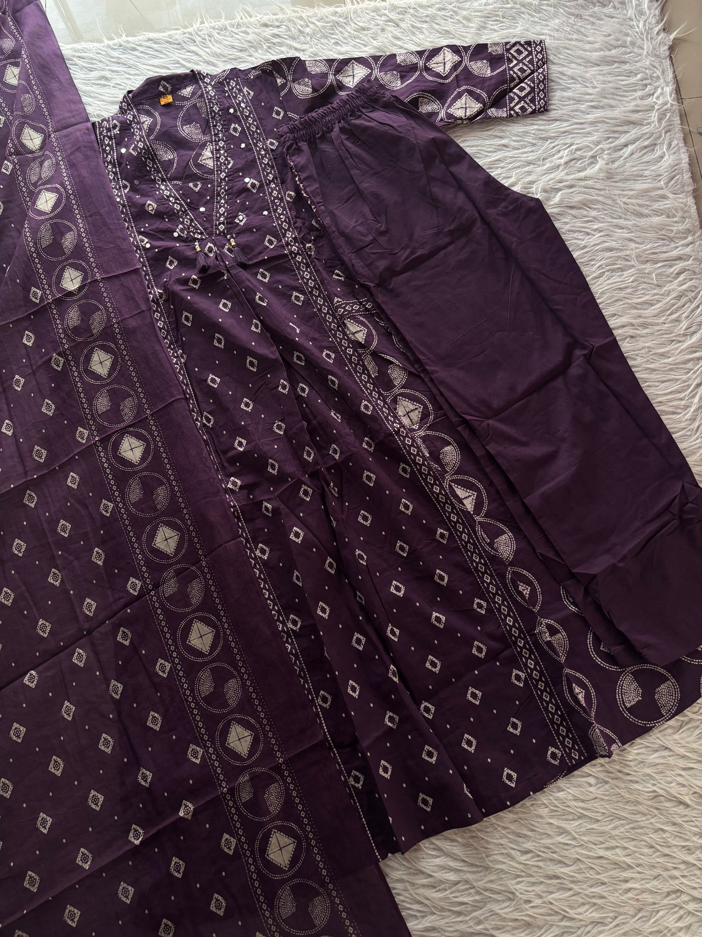 MD-267 Captions for Your Berry  Bandhani Set
Here are a few caption options tailored for different social media vibes, highlighting the intricate mirror work and classic Bandhani print of this outfit.