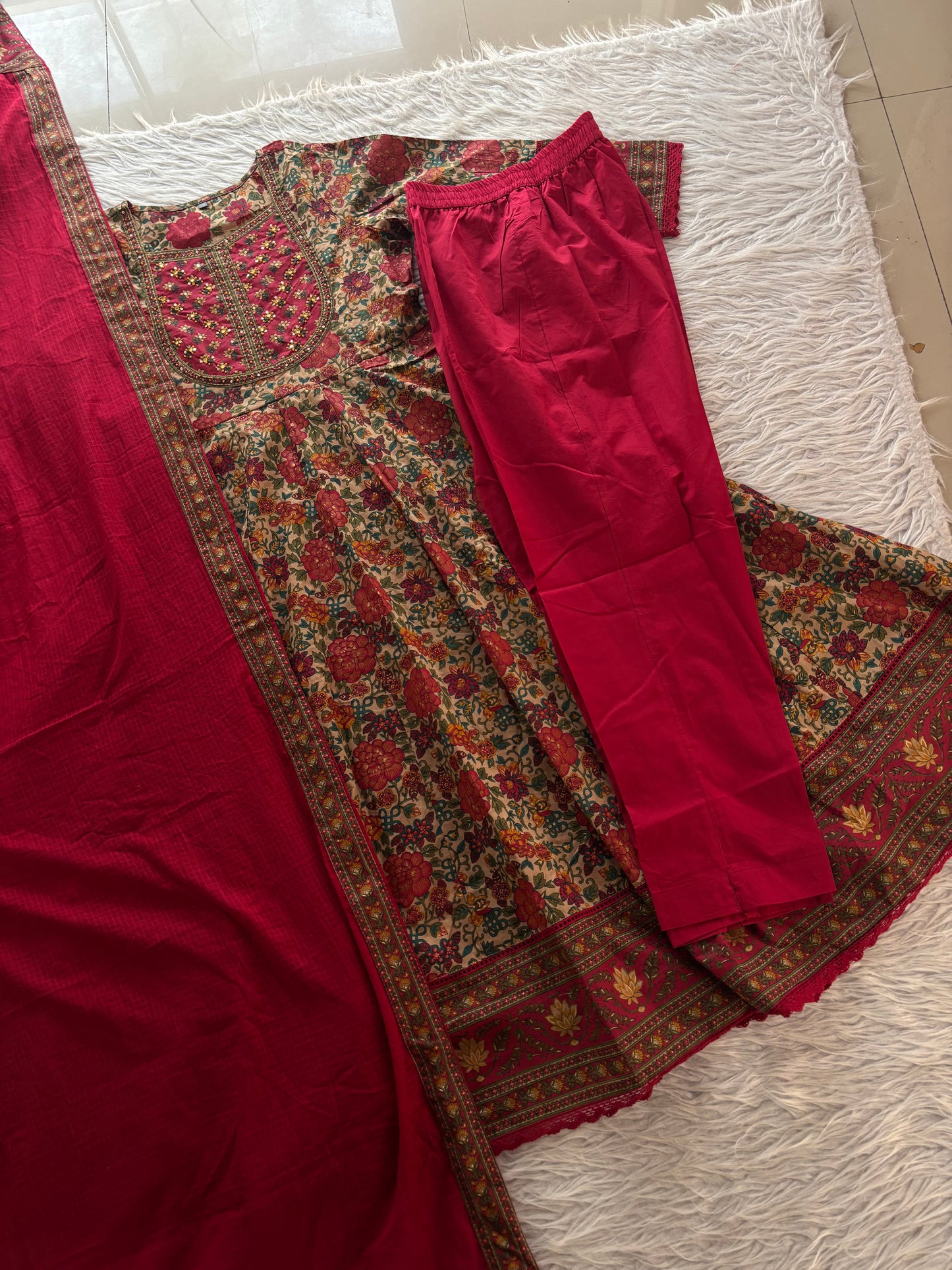 MD-273 "Embracing timeless tradition with a modern twist. Loving the rich hues, intricate Kalamkari-inspired prints, and delicate mirror work on this gorgeous tiered suit set. ✨💛"