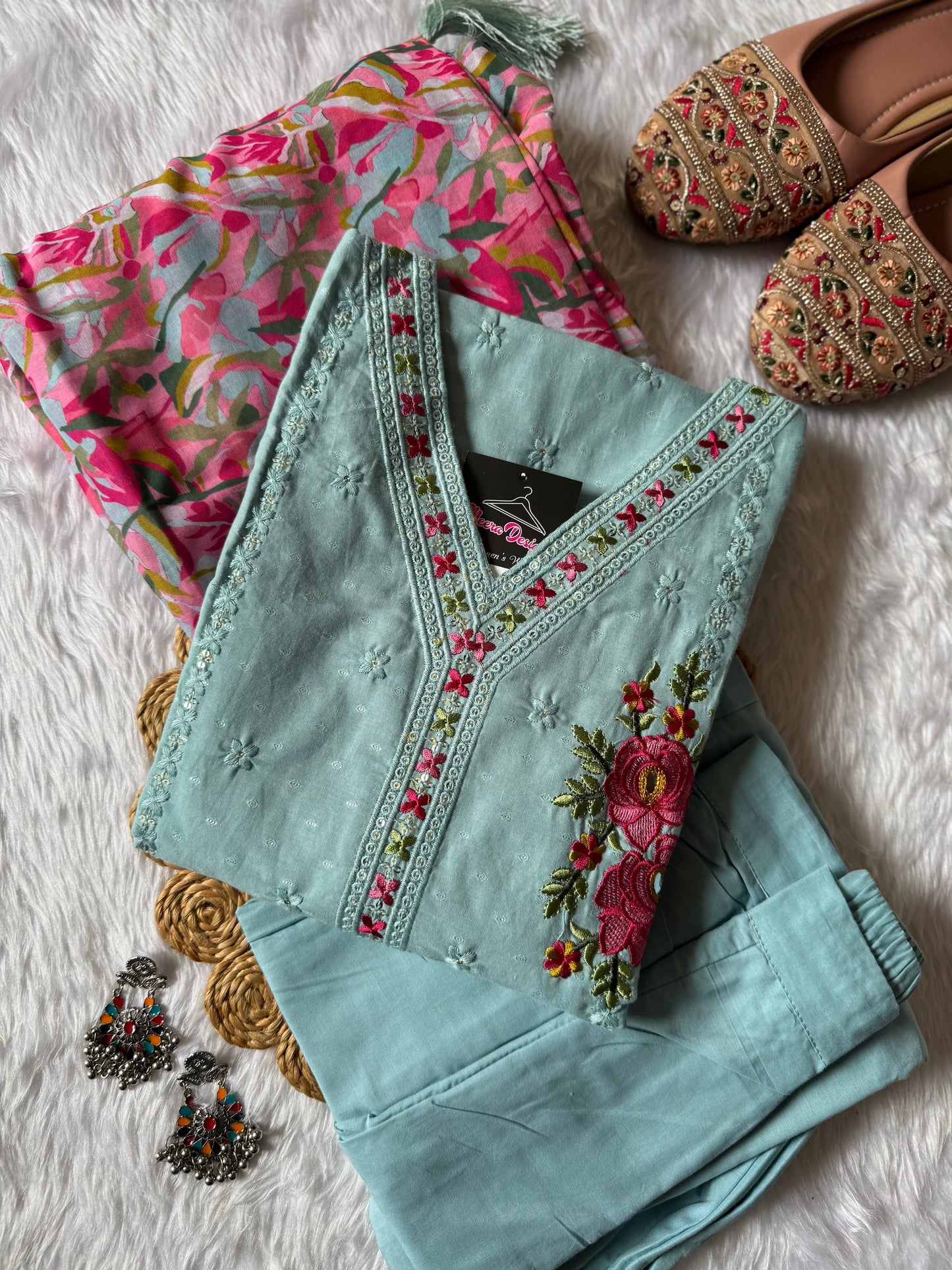 MD-178 This pastel grey suit set features delicate thread embroidery with vibrant pink floral motifs, paired with a colorful printed dupatta that adds a lively contrast. Perfect blend of subtle elegance and festive charm! ✨💗