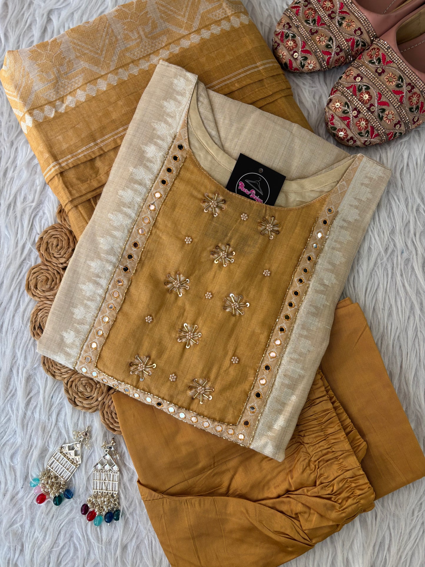 MD-266 This is a beautiful, understated three-piece Salwar Kameez set that perfectly balances traditional elegance with a modern, earthy color palette. It’s a great choice for semi-formal gatherings or festive daytime events.