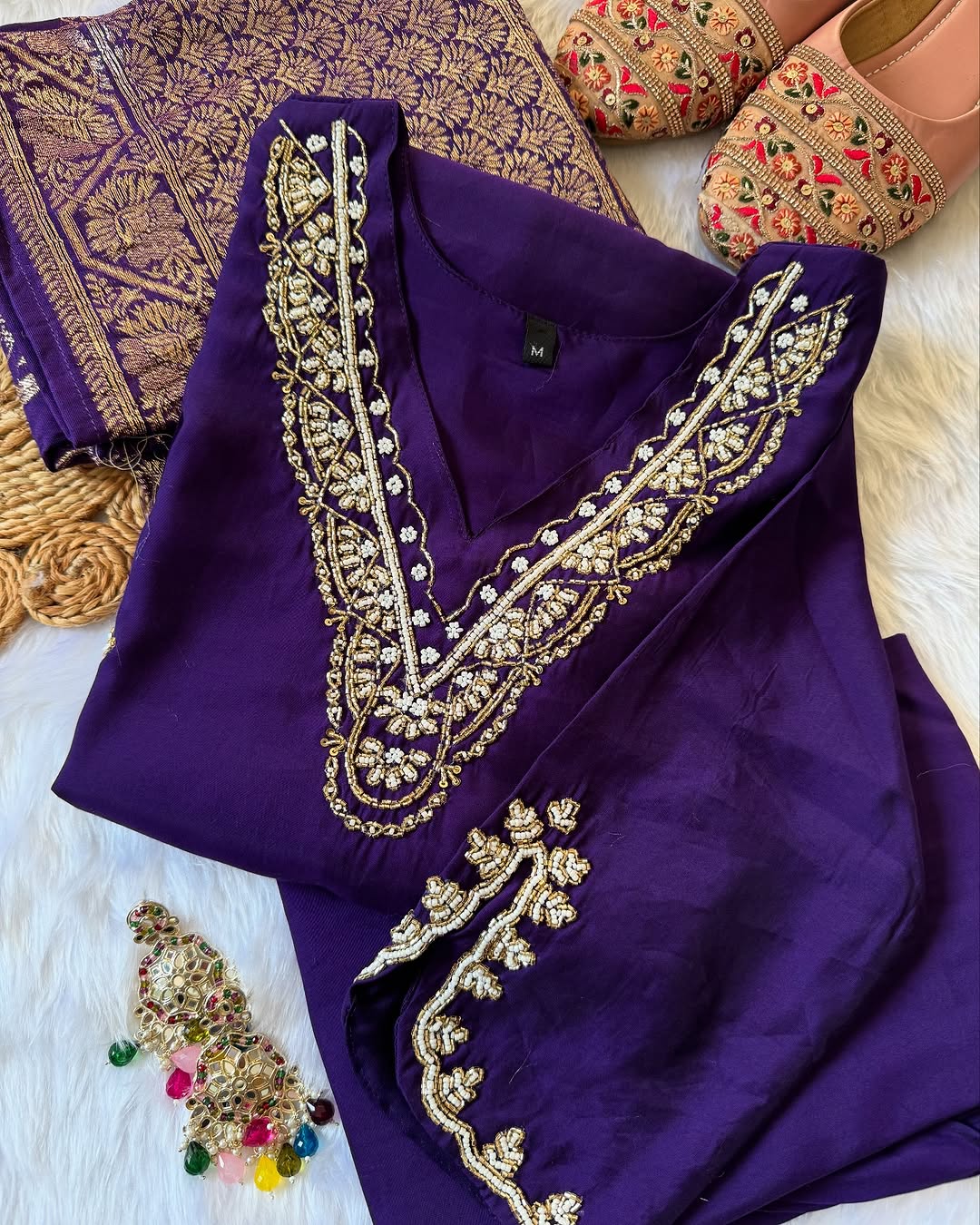 MD-196 "Radiate elegance in this rich  suit set, featuring delicate mirror work on the neckline, subtle embroidery on the kurta, and a beautifully woven dupatta — perfect for festive charm and graceful gatherings."