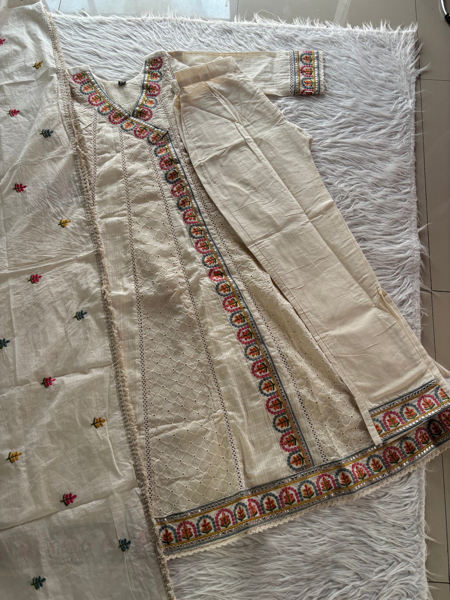 MD-248 Elegant Ethnic Ensembles
Here are a few caption options for this ivory suit set, ranging from classic to trendy:
